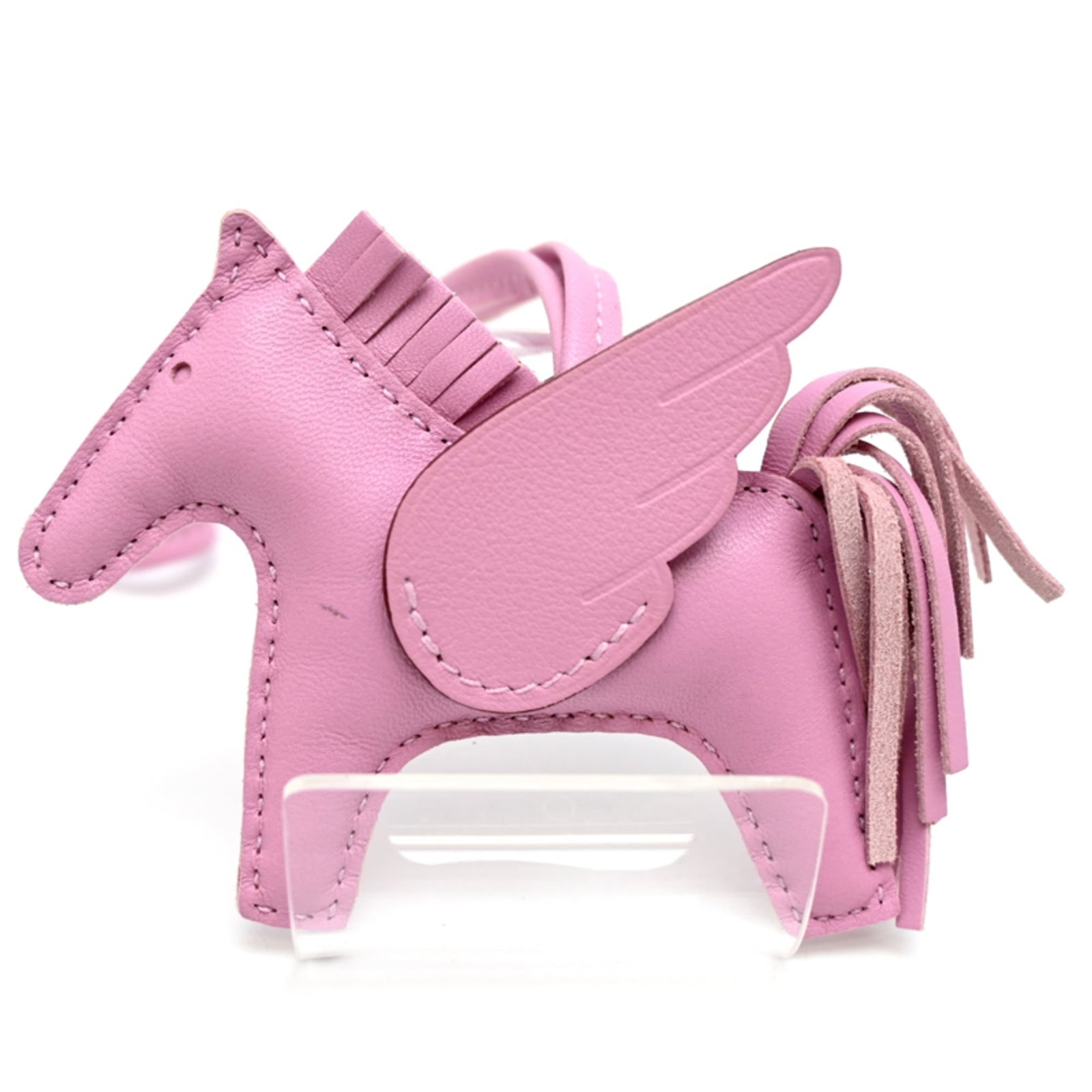 Hermes Agneau Milo Handbag Charm: Hermes Agneau Milo Handbag Charm A rare opportunity to own a piece of luxury, the Hermes Agneau Milo Handbag Charm is a sleek and sophisticated accessory that adds a touch of elegance to any outfit. M