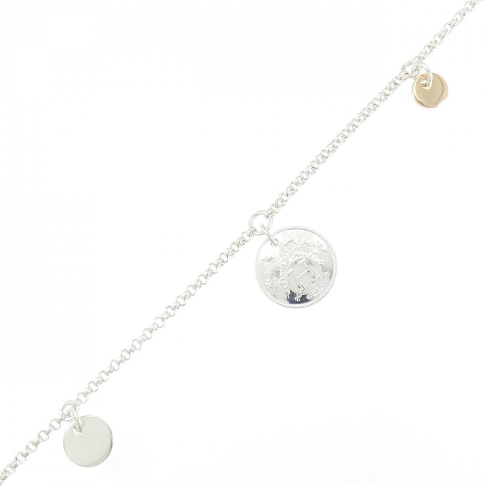 Silver 925 - Hermes Charm Bracelet Pink Gold (18K): Silver 925 - Hermes Charm Bracelet Pink Gold (18K) A stunning Herm?s charm bracelet in 18K pink gold, adorned with silver accents, adds a touch of elegance to any outfit. This pre-loved piece boasts a