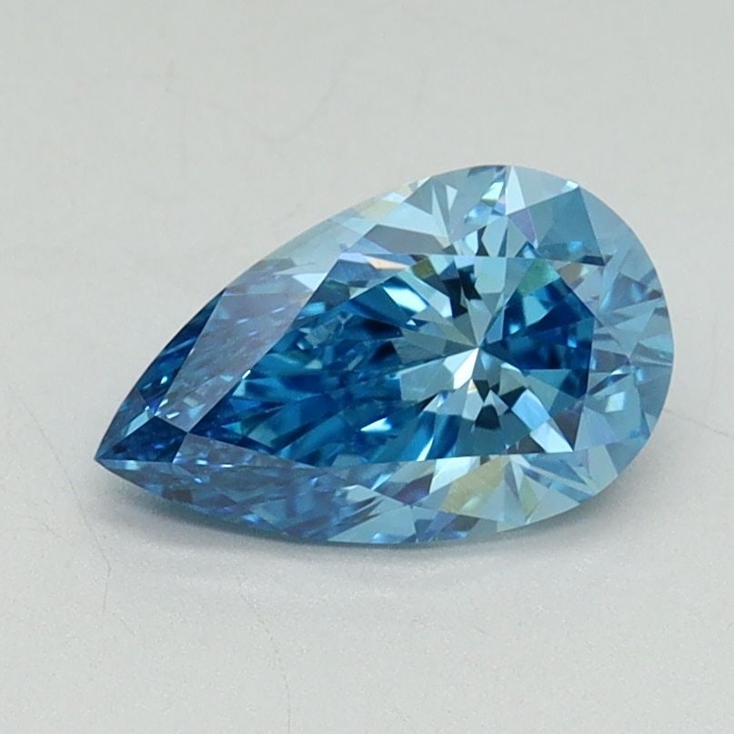 Loose Lab Diamond - IGI Pear 1.03ct Fancy Vivid Blue VVS2: Loose Lab Diamond - IGI Pear 1.03ct Fancy Vivid Blue VVS2 A stunning Fancy Vivid Blue lab diamond, certified by the International Gemological Institute (IGI), boasts exceptional clarity and polish.