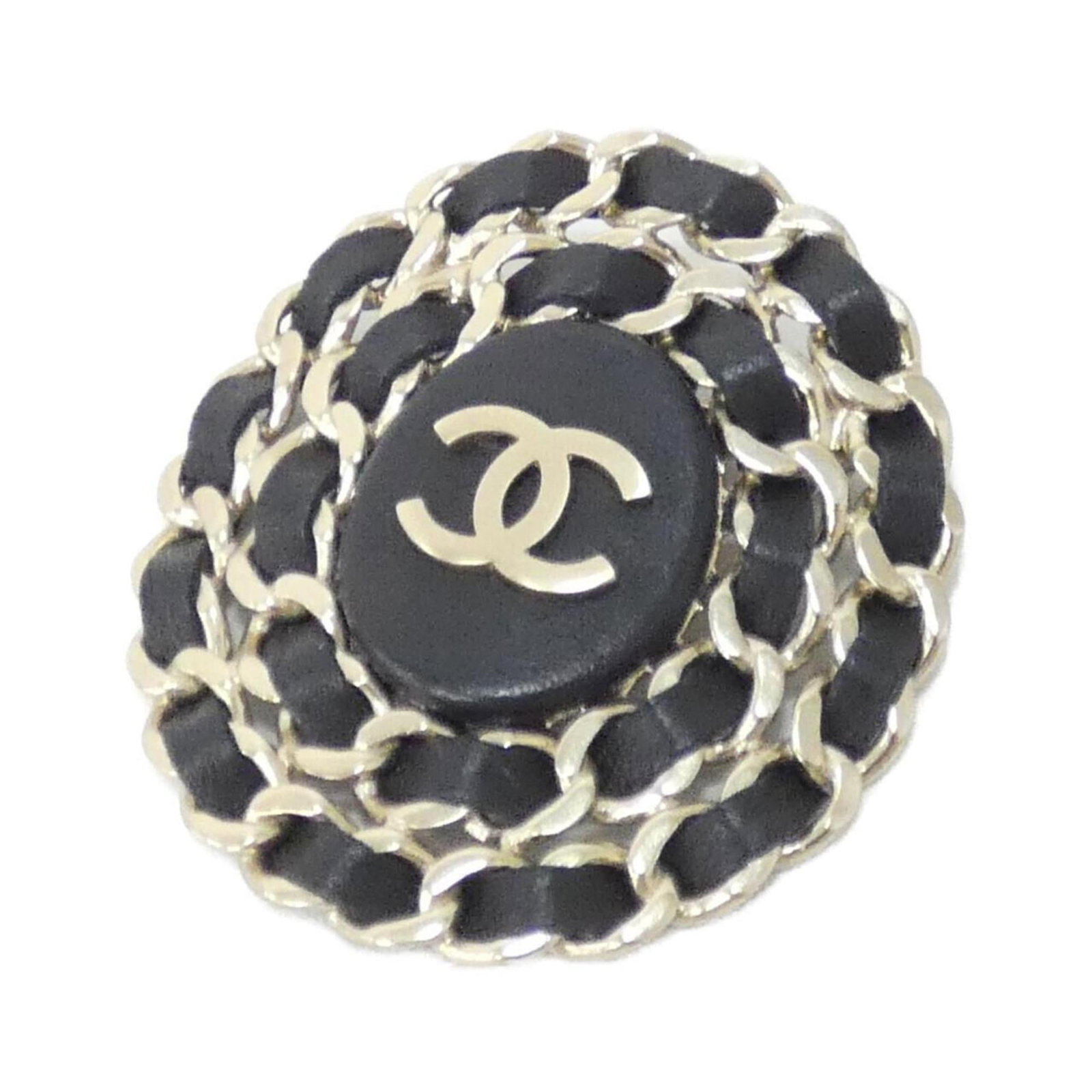 Chanel Brooch in Leather: Chanel Brooch in Leather A sleek and sophisticated Chanel brooch in black leather, adorned with subtle gold accents, adds a touch of timeless elegance to any outfit. With its classic design and premiu
