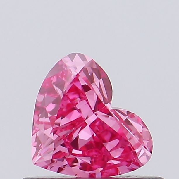 IGI Heart 0.32ct Fancy Vivid Pink VVS2 Loose Lab Diamond: IGI Heart 0.32ct Fancy Vivid Pink VVS2 Loose Lab Diamond Experience the beauty of a lab-grown diamond, certified by IGI as Fancy Vivid Pink with exceptional clarity and polish. This 0.32ct gemstone bo