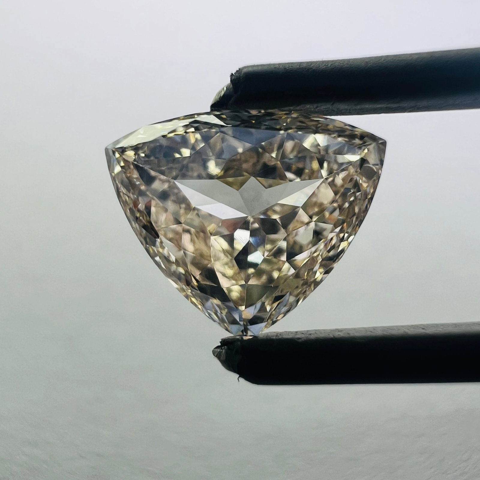 Pink VVS2 1.89ct Trilliant Lab Diamond: Pink VVS2 1.89ct Trilliant Lab Diamond A stunning pink Trilliant lab diamond, certified VVS2 clarity and boasting exceptional cut quality, shines with vibrant color in this 1.89ct gemstone. Its unique