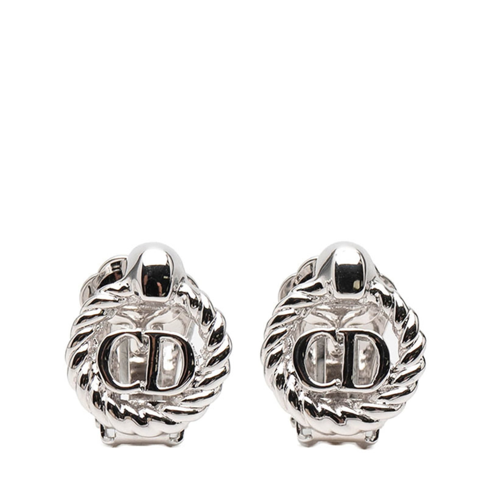 Christian Dior Clip Earrings in Metal: Christian Dior Clip Earrings in Metal Add a touch of sophisticated elegance to your everyday look with these stunning Christian Dior clip earrings in silver metal. With their sleek design and durable
