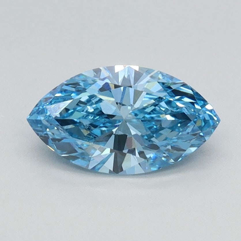 IGI Marquise 0.71ct Fancy Vivid Blue VVS2 Loose Lab Diamond: IGI Marquise 0.71ct Fancy Vivid Blue VVS2 Loose Lab Diamond Experience the breathtaking beauty of a Fancy Vivid Blue lab diamond, boasting an exceptional 0.71 carat size and VVS2 clarity. Its vibrant