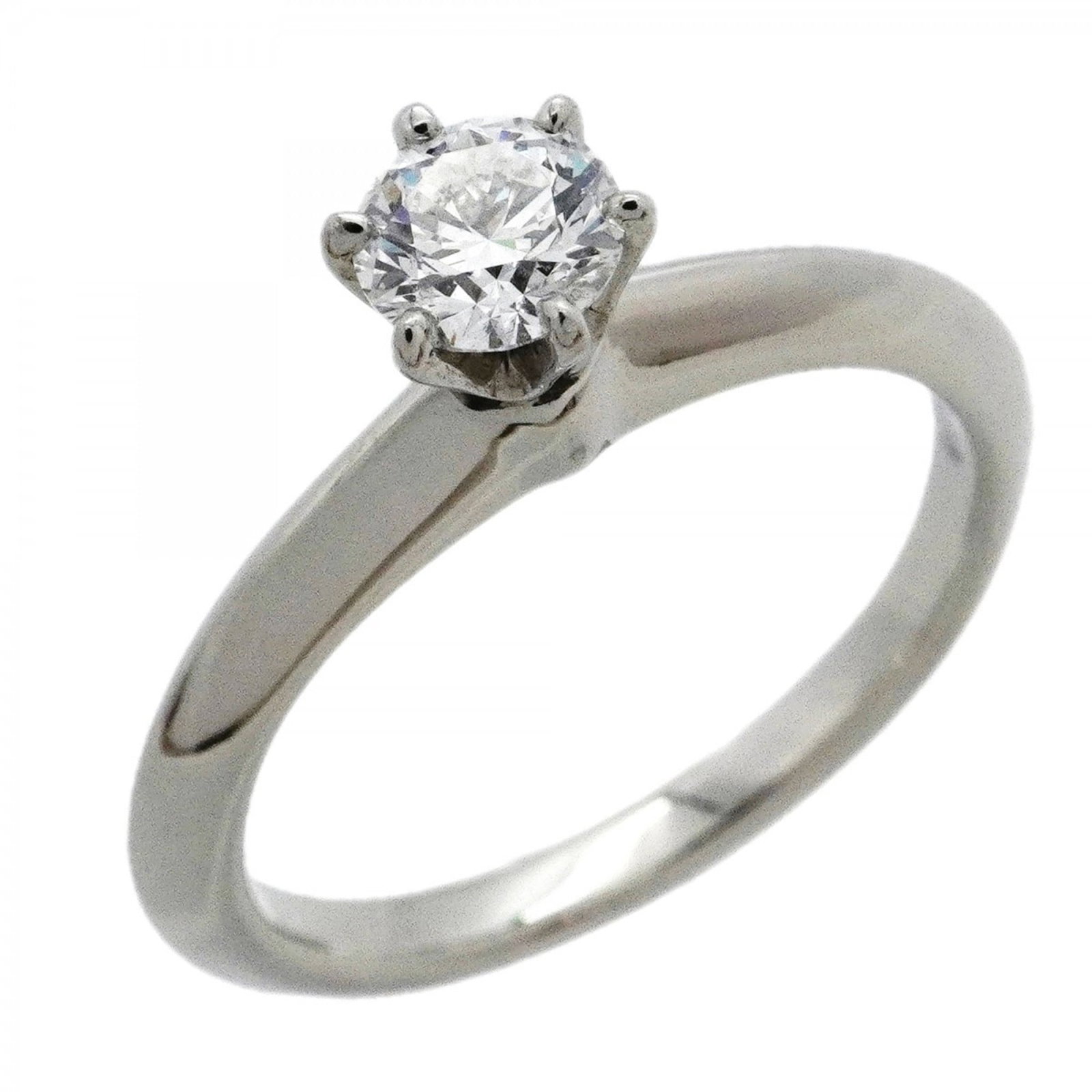 950 Tiffany Band Ring Platinum: 950 Tiffany Band Ring Platinum A stunning 950 platinum band ring from Tiffany & Co., adorned with a beautiful diamond stone, adds a touch of timeless elegance to any outfit. With its sleek platinum de