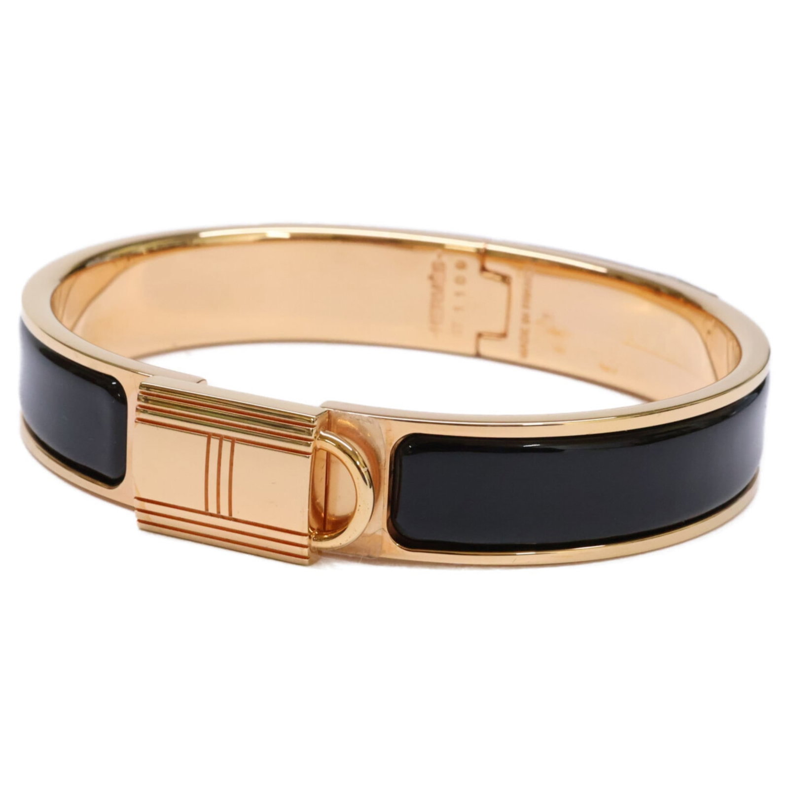 Hermes Metal Bangle: Hermes Metal Bangle Elevate your style with the iconic Hermes Metal Bangle, boasting sleek black and rose gold tones that exude sophistication. This timeless piece is crafted from high-quality metal a