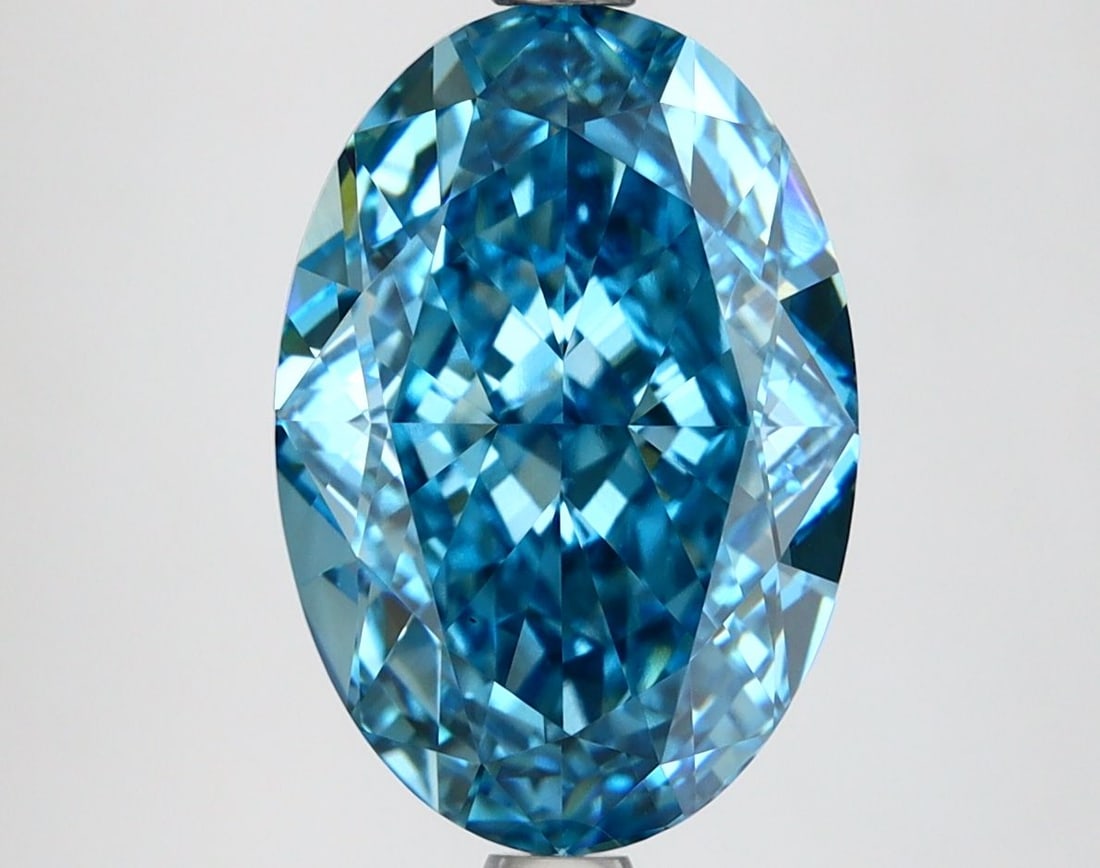 IGI Oval 4.89ct Fancy Vivid Blue VVS2 Loose Lab Diamond: IGI Oval 4.89ct Fancy Vivid Blue VVS2 Loose Lab Diamond Experience the rare beauty of a Fancy Vivid Blue diamond, one of the most coveted colors in the world of gemstones. This stunning 4.89ct lab-gro