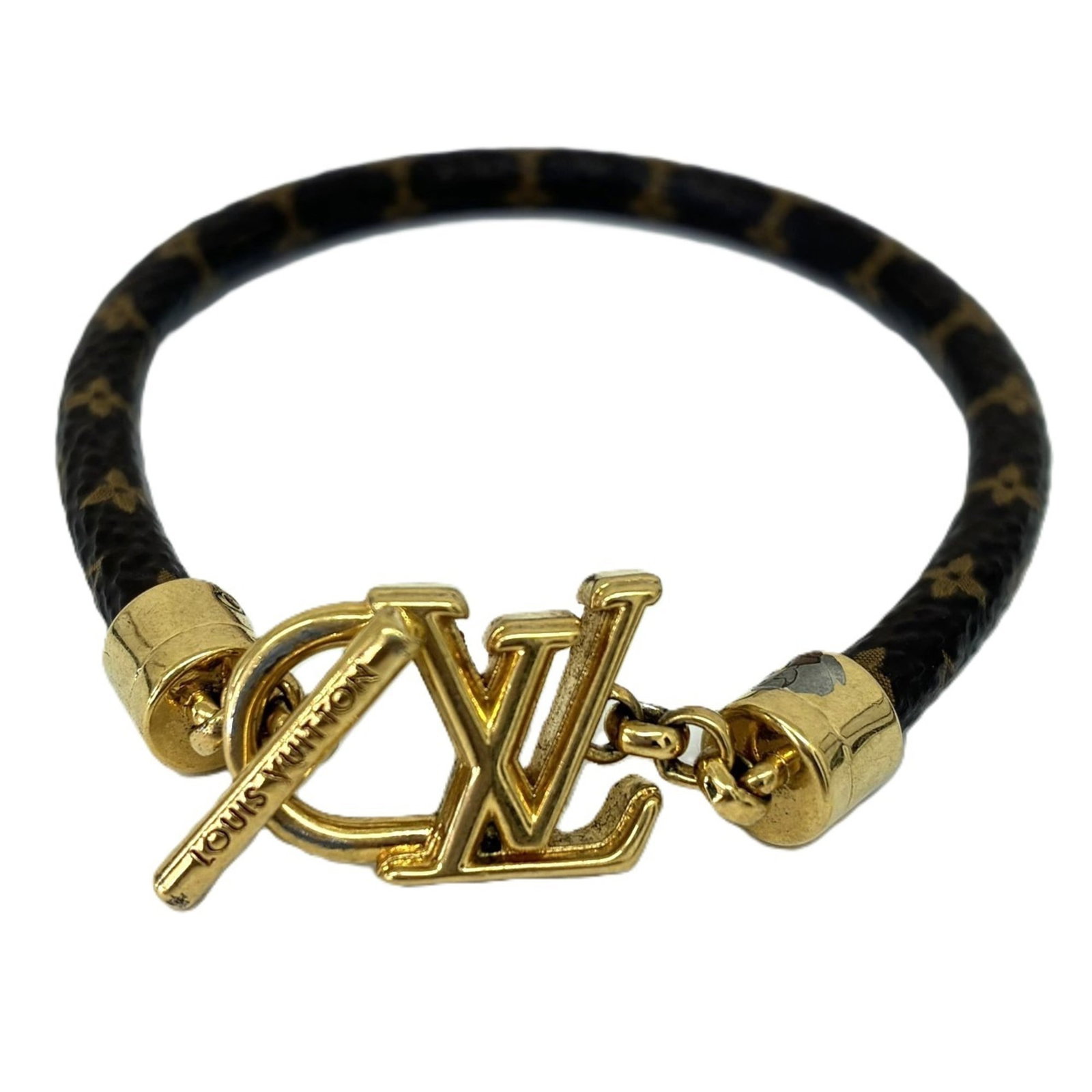 Louis Vuitton Leather Charm Bracelet: Louis Vuitton Leather Charm Bracelet A timeless piece from the iconic Louis Vuitton brand, this brown leather charm bracelet boasts classic French elegance with its supple leather strap and subtle cha