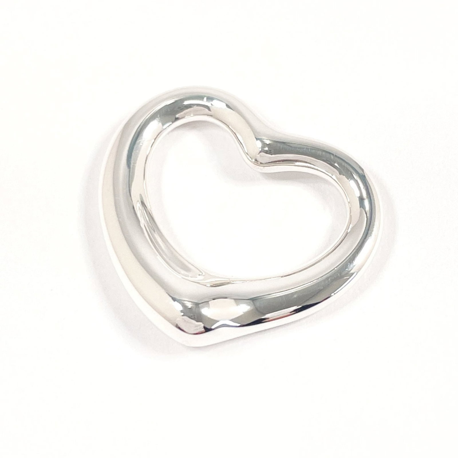 Tiffany & Co. Elsa Peretti Sterling Silver Open Heart Pendant for Women: Tiffany & Co. Elsa Peretti Sterling Silver Open Heart Pendant for Women Elegant and timeless, the Tiffany & Co. Elsa Peretti sterling silver open heart pendant is a classic choice for women who apprec