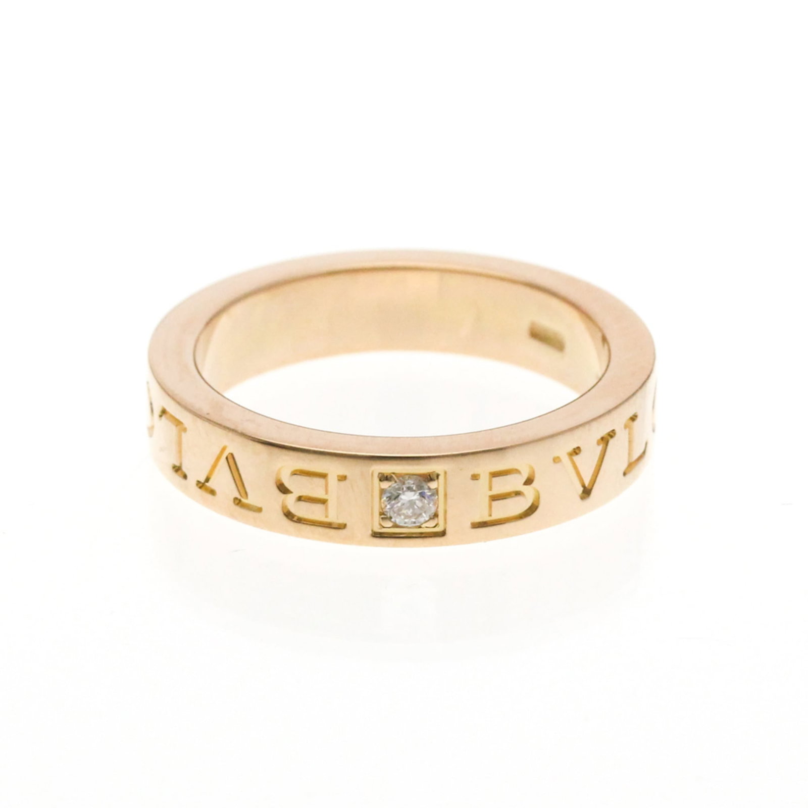 Pink Gold 18k Bvlgari Band Ring: Pink Gold 18k Bvlgari Band Ring Elevate your style with this stunning 18k pink gold Bvlgari band ring, boasting a sleek and sophisticated design that exudes luxury. The delicate diamond accent adds a