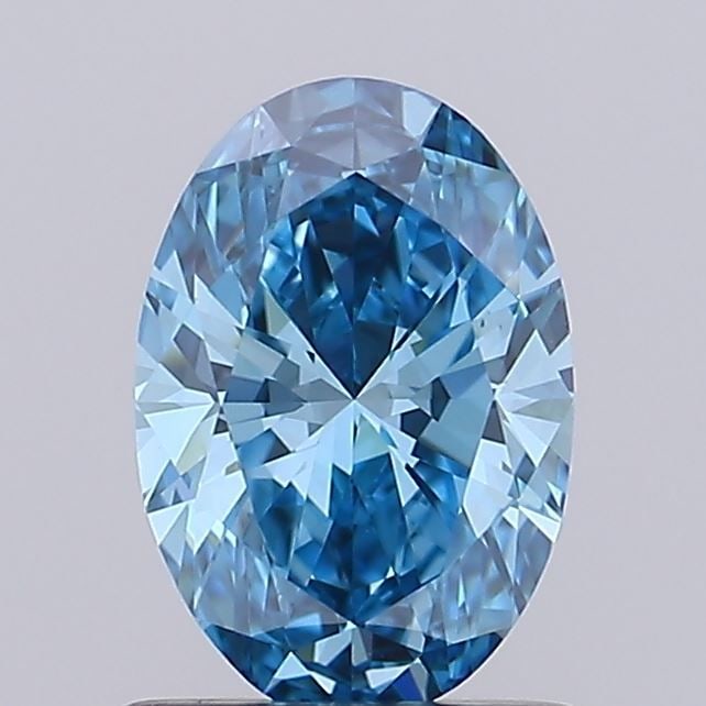 IGI Oval 0.94ct Fancy Vivid Blue VVS1 Loose Lab Diamond: IGI Oval 0.94ct Fancy Vivid Blue VVS1 Loose Lab Diamond Experience the rare beauty of a Fancy Vivid Blue diamond, one of the most coveted colors in the world of gemstones. This exquisite 0.94ct lab-gr