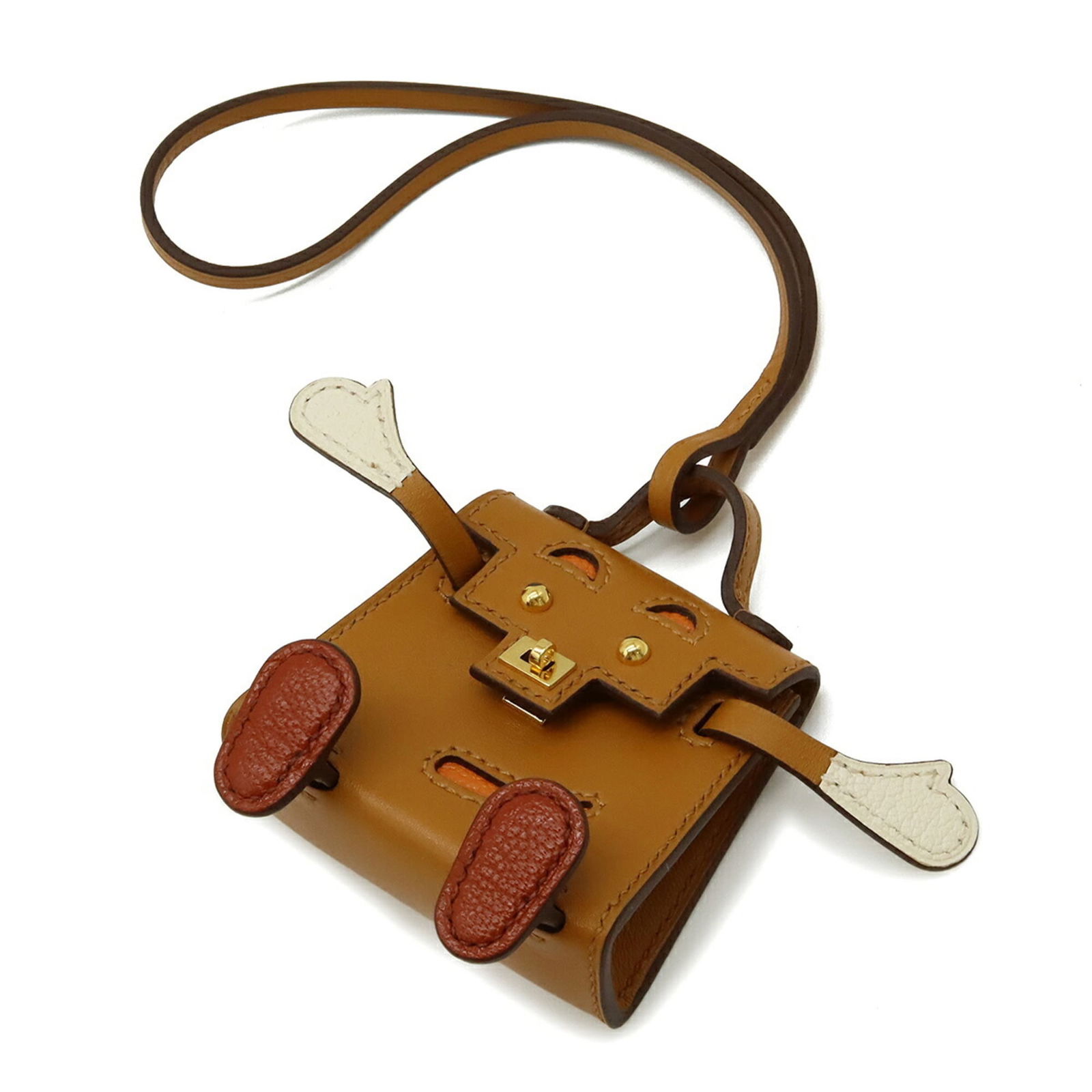 Charm Hermes Handbag: Charm Hermes Handbag A rare and coveted piece, this Charm Hermes Handbag is a miniature replica of the iconic Birkin bag, boasting intricate details and timeless design. Its rich Brique, Natural Sable