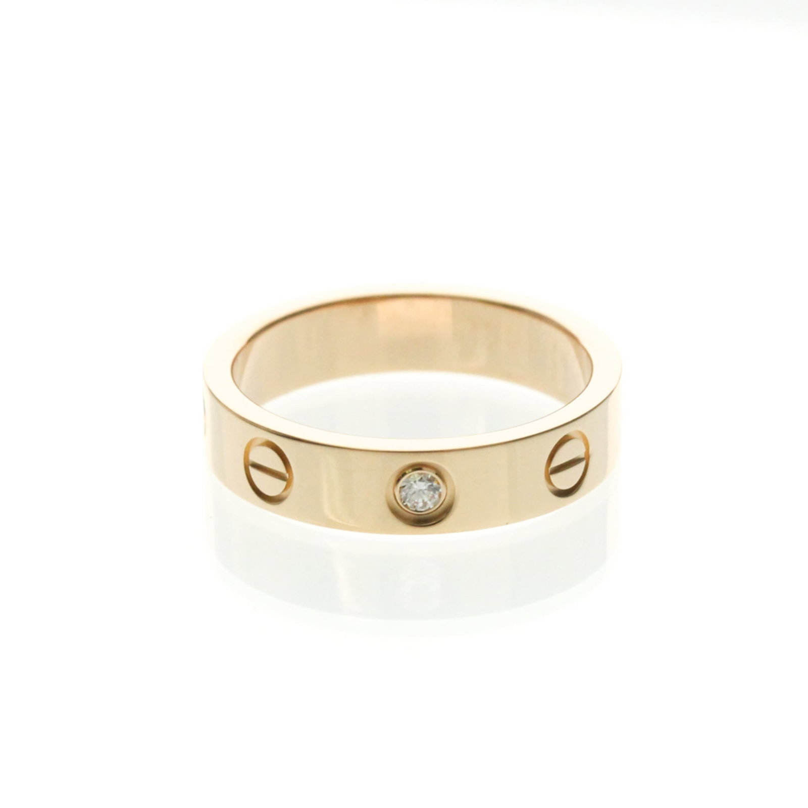 Pink Gold 18k Cartier Band Ring: Pink Gold 18k Cartier Band Ring A stunning 18k pink gold Cartier band ring, crafted with timeless elegance and sophistication, boasts a sleek design that exudes luxury. This beautiful piece is adorned