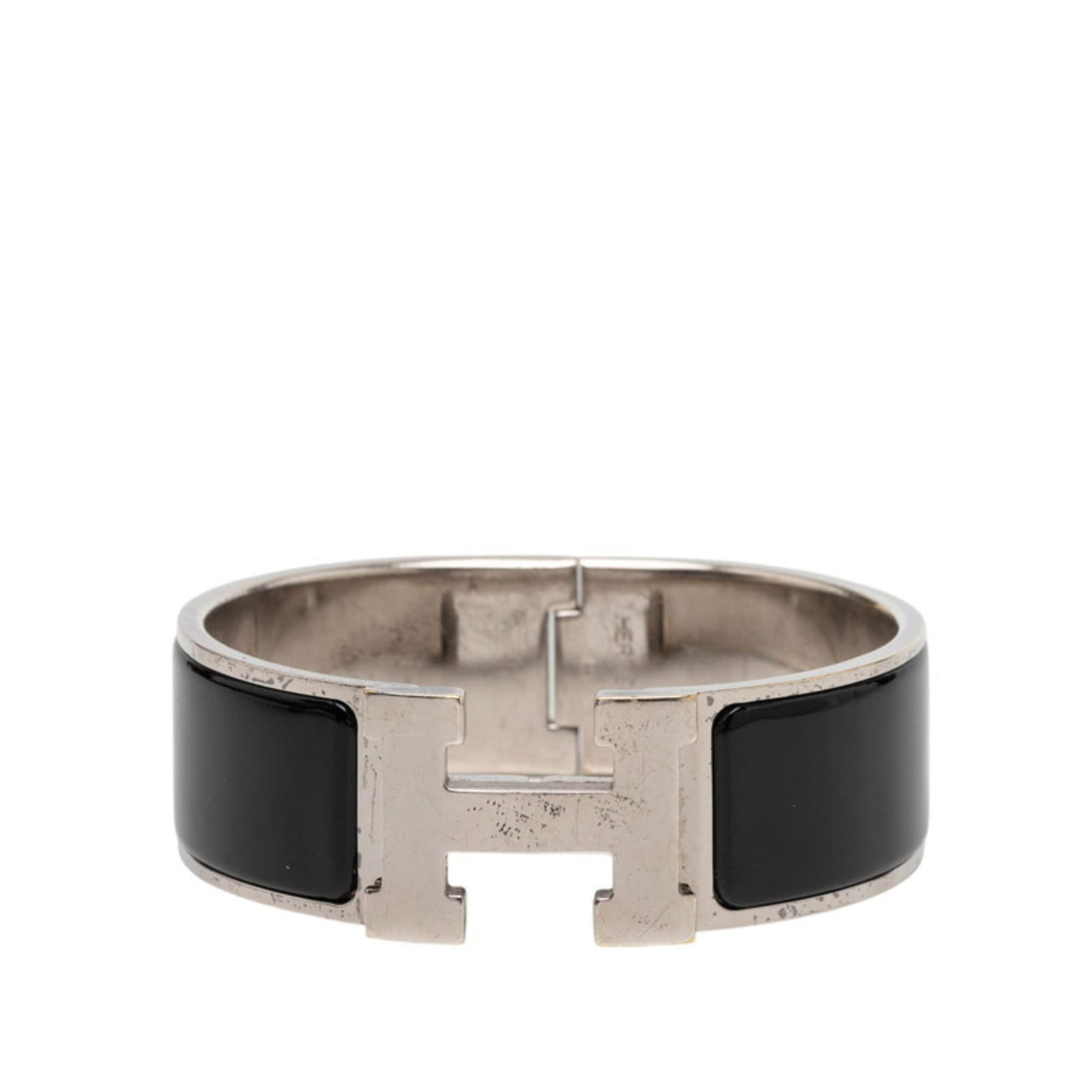 Hermes Bangle with Enamel: Hermes Bangle with Enamel A sleek and sophisticated Hermes bangle, this black enamel piece adds a touch of luxury to any outfit. With its classic design and high-quality materials, it's a timeless acc