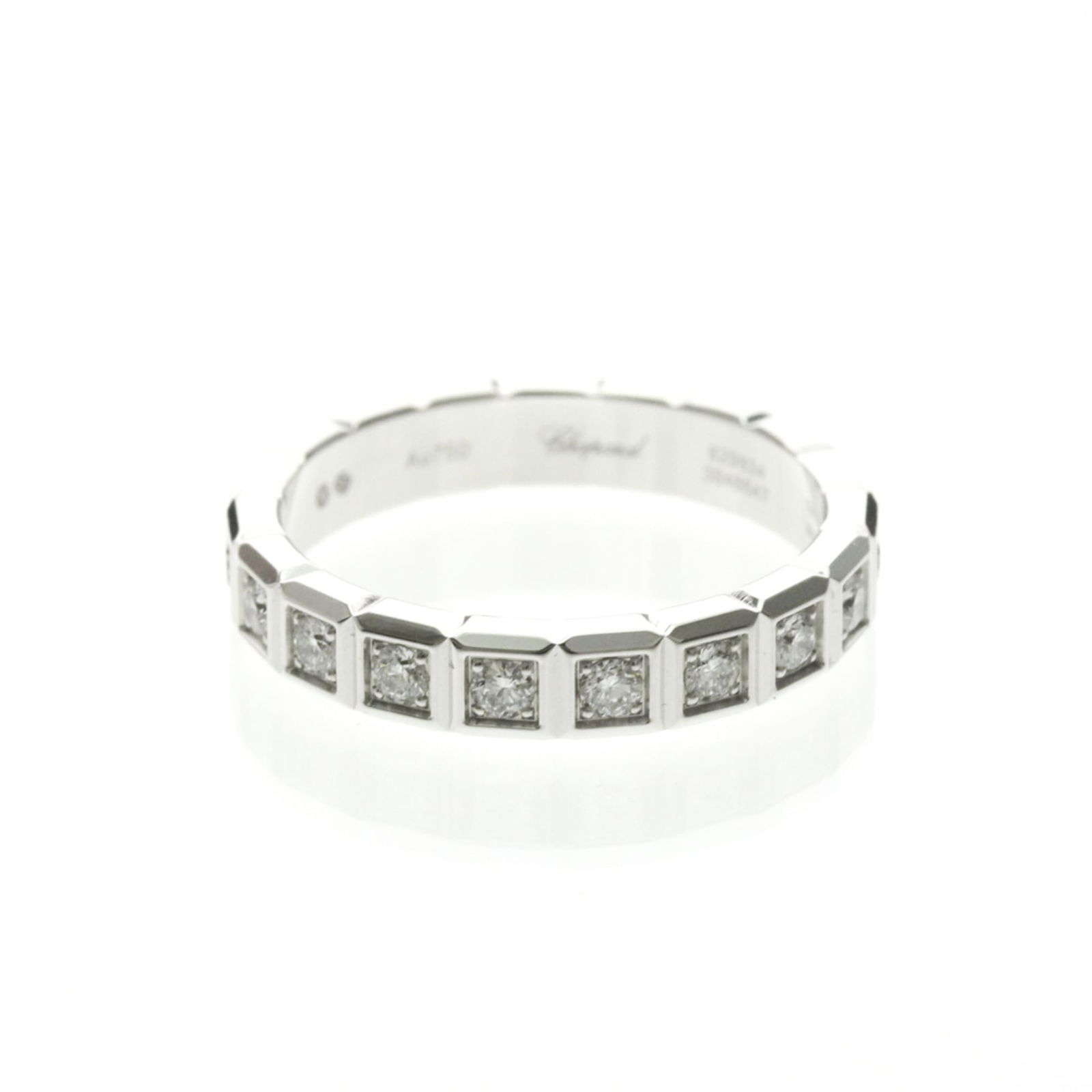 Chopard 18k White Gold Band Ring: Chopard 18k White Gold Band Ring A stunning 18k white gold band ring from renowned luxury brand Chopard, boasting a sleek and sophisticated design that suits both men and women alike. With its delicat