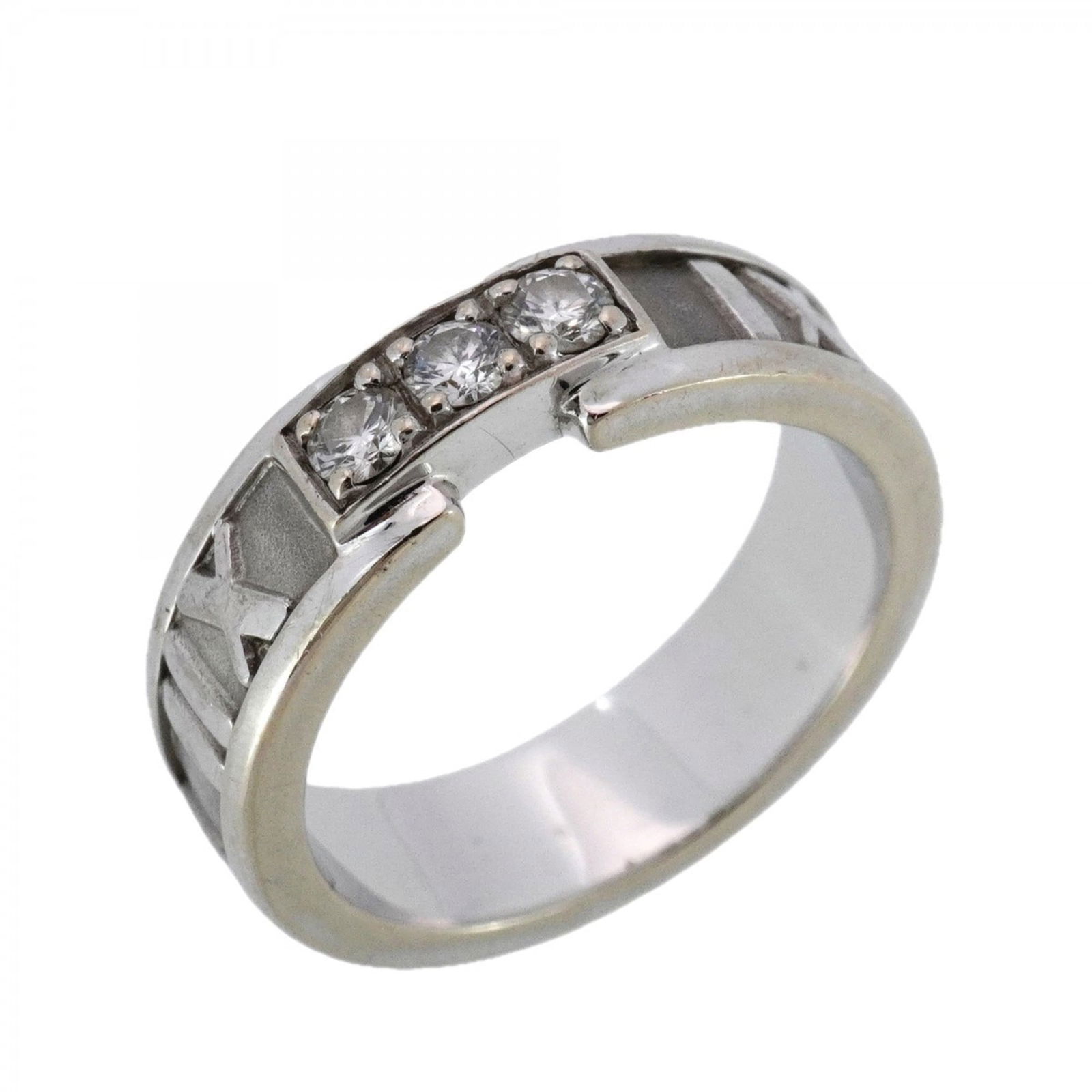 (18K) Tiffany Band Ring White Gold: (18K) Tiffany Band Ring White Gold A stunning 18K white gold band ring from Tiffany, adorned with a beautiful diamond stone, adds a touch of elegance to any outfit. With its classic design and premium