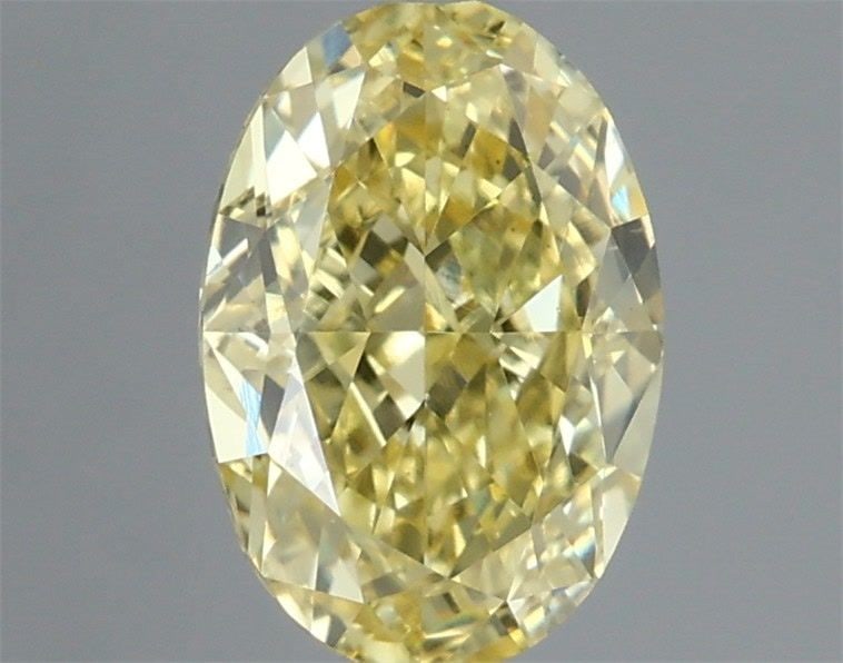 IGI Oval 1.12ct Fancy Intense Yellow VVS2 Loose Lab Diamond: IGI Oval 1.12ct Fancy Intense Yellow VVS2 Loose Lab Diamond Experience the vibrant warmth of a Fancy Intense Yellow diamond, one of the rarest and most coveted colors in nature. This stunning 1.12ct l