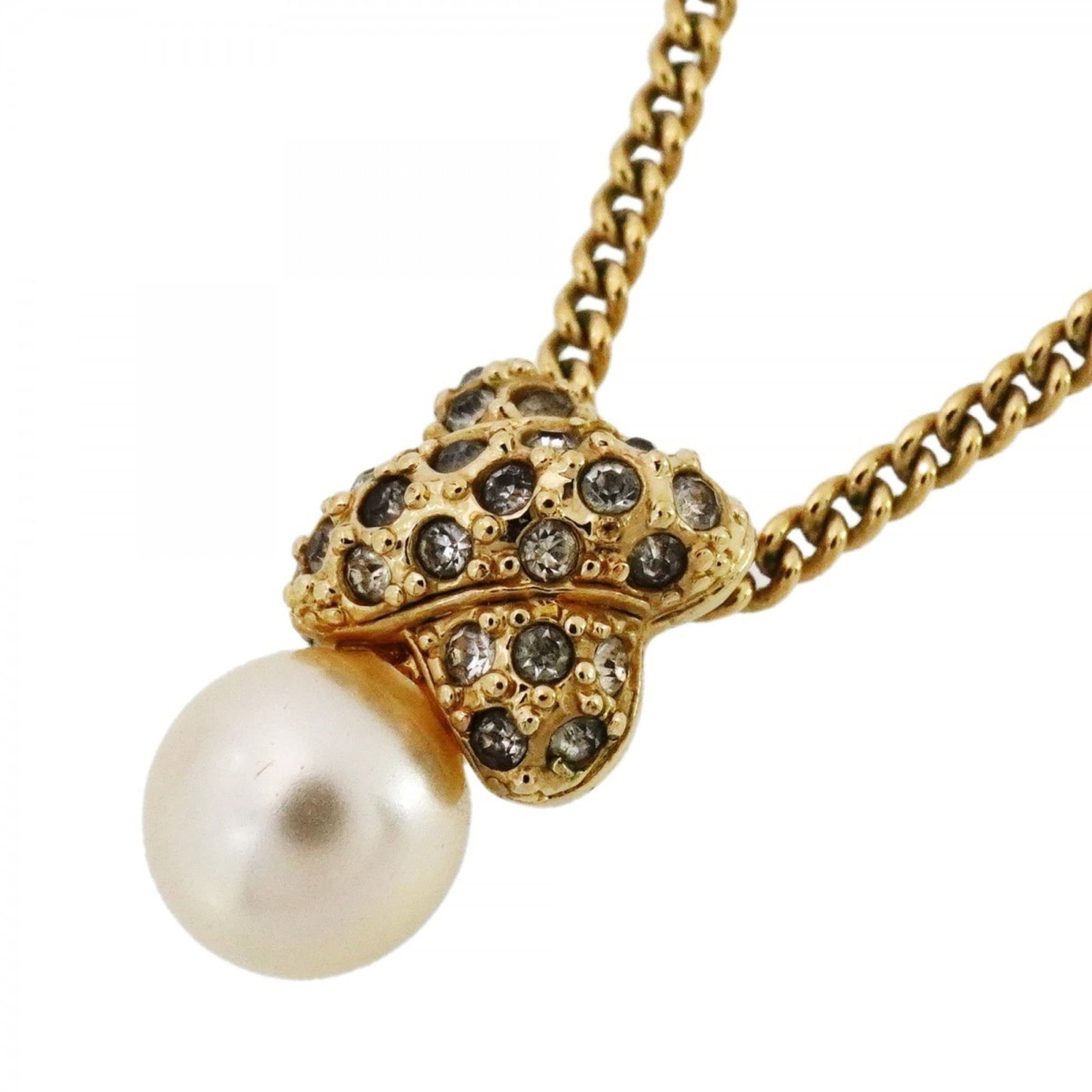 Christian Dior Cross Necklace in Gold with GP Plated Rhinestones and Faux Pearls: Christian Dior Cross Necklace in Gold with GP Plated Rhinestones and Faux Pearls Elevate your style with the iconic Christian Dior Cross Necklace, featuring 14k gold plating and stunning GP plated rhi