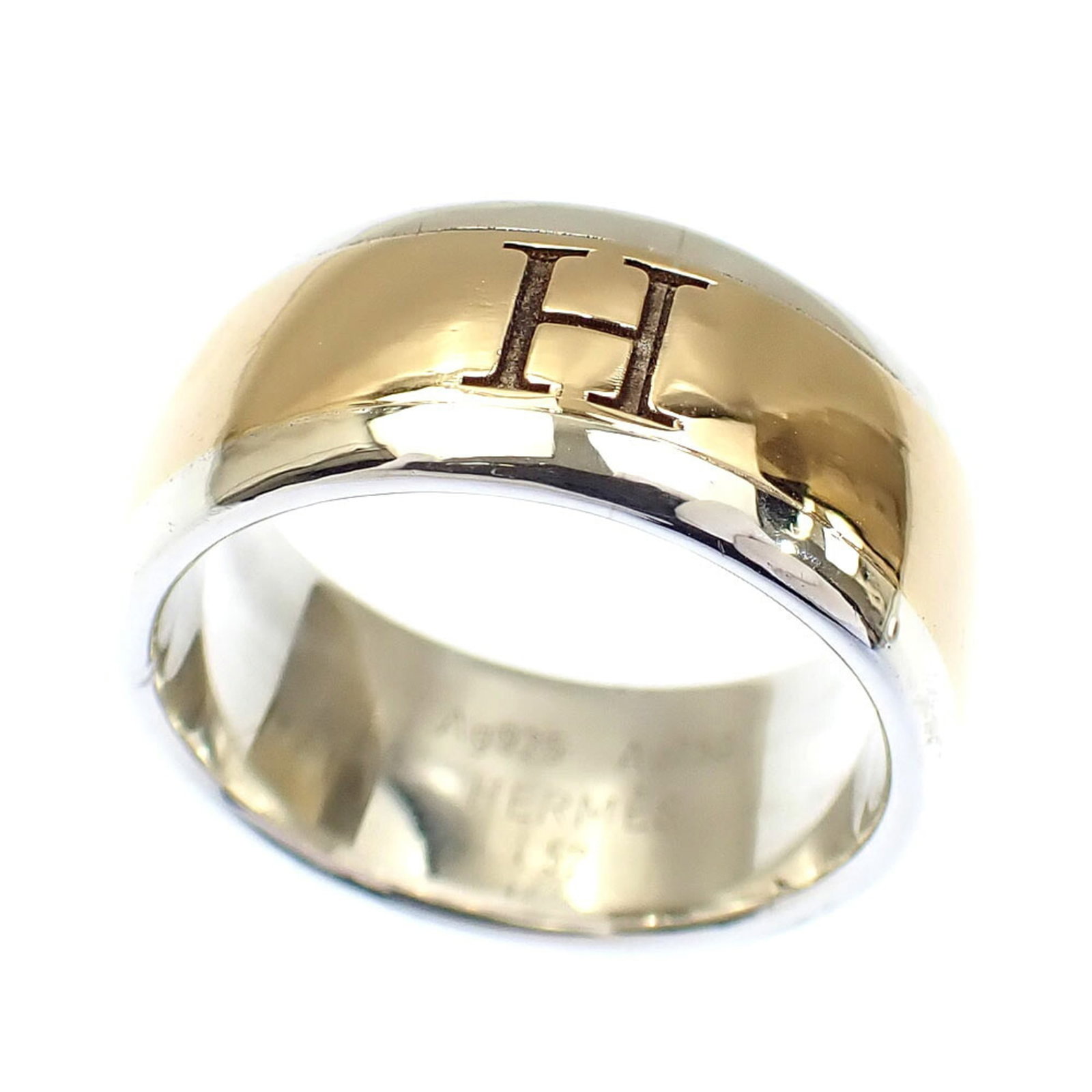 Hermes 18k Yellow Gold Silver Band Ring: Hermes 18k Yellow Gold Silver Band Ring Elevate your style with this stunning 18k yellow gold and silver band ring from Hermes, featuring a sleek and modern design that adds a touch of luxury to any o