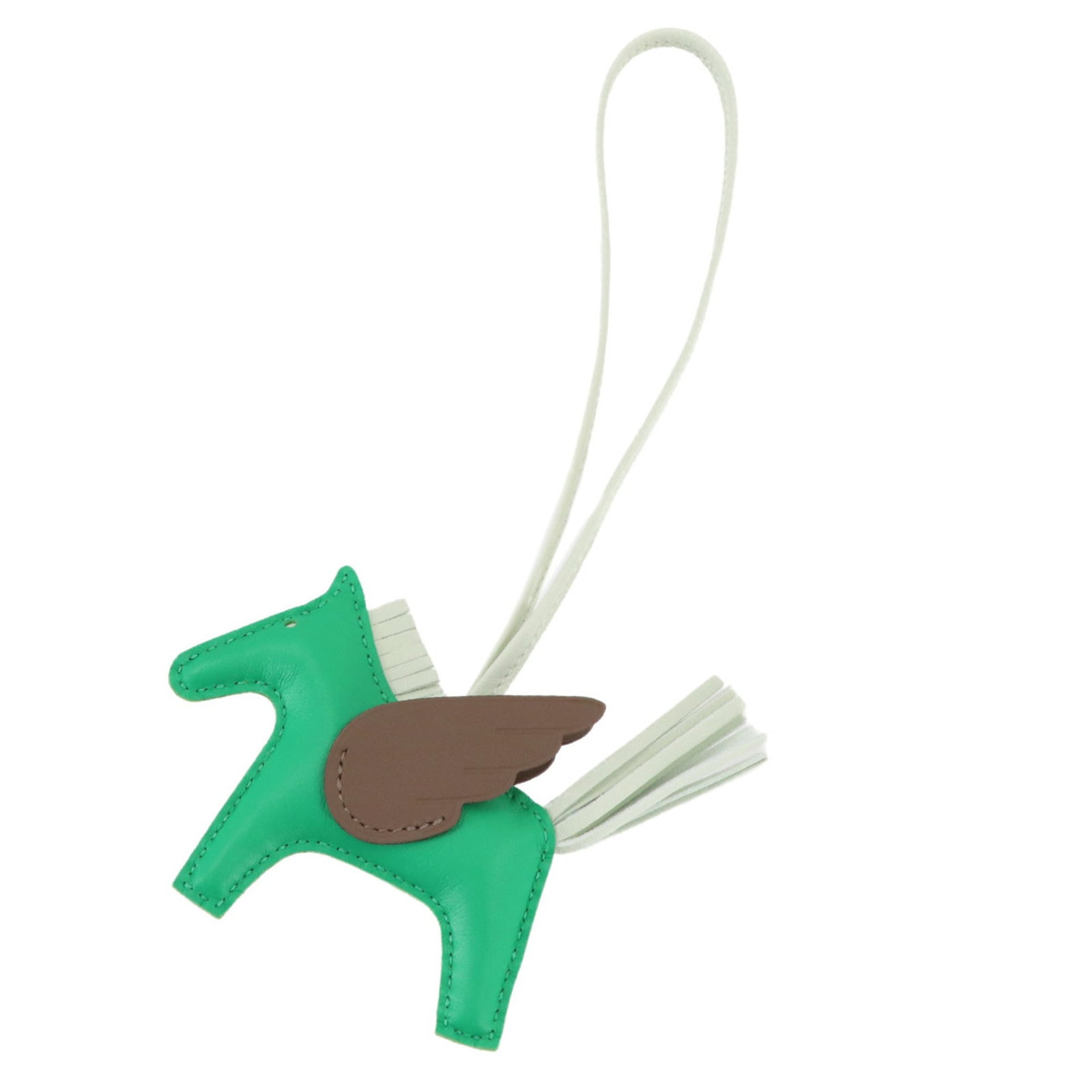 Hermes Agneau Milo Handbag Charm: Hermes Agneau Milo Handbag Charm A stunning Hermes Agneau Milo charm, expertly crafted from the finest green Agneau Milo material, adds a touch of elegance to any handbag. This exquisite piece, measur