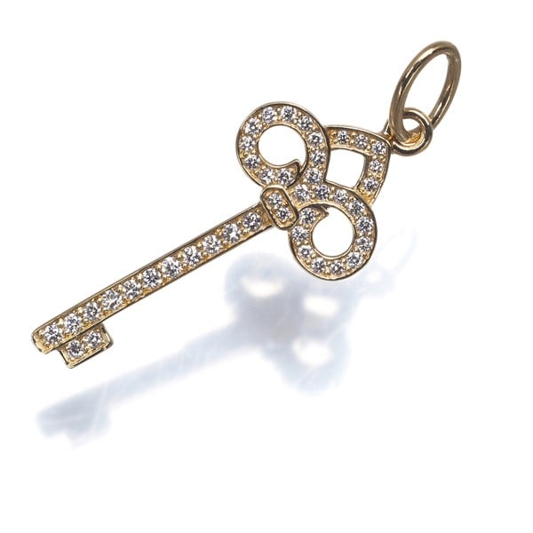 Yg Tiffany&Co. Pendant Diamond 0.10Ct Fleur De Lis Key Mini Charm 18K: Yg Tiffany&Co. Pendant Diamond 0.10Ct Fleur De Lis Key Mini Charm 18K Elevate your style with the iconic Tiffany & Co. Fleur de Lis Key charm, set in 18k yellow gold and adorned with a natural 0.10ct