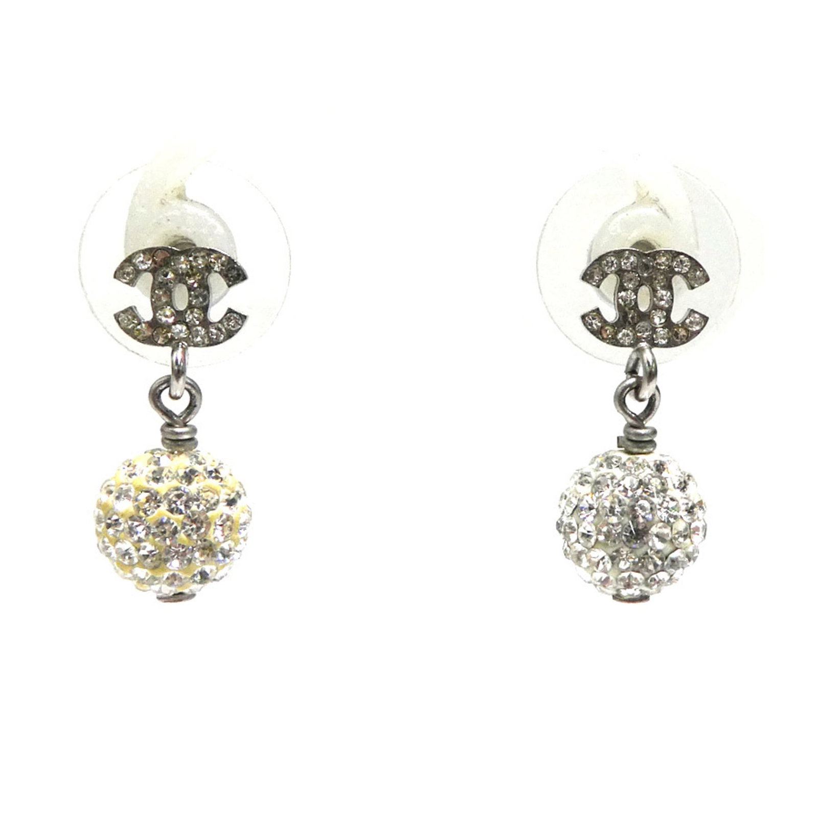 Rhinestone - Chanel Drop Earrings Metal: Rhinestone - Chanel Drop Earrings Metal Elevate your style with these stunning Chanel drop earrings, adorned with intricate rhinestones in silver metal. The classic design and luxurious details make t