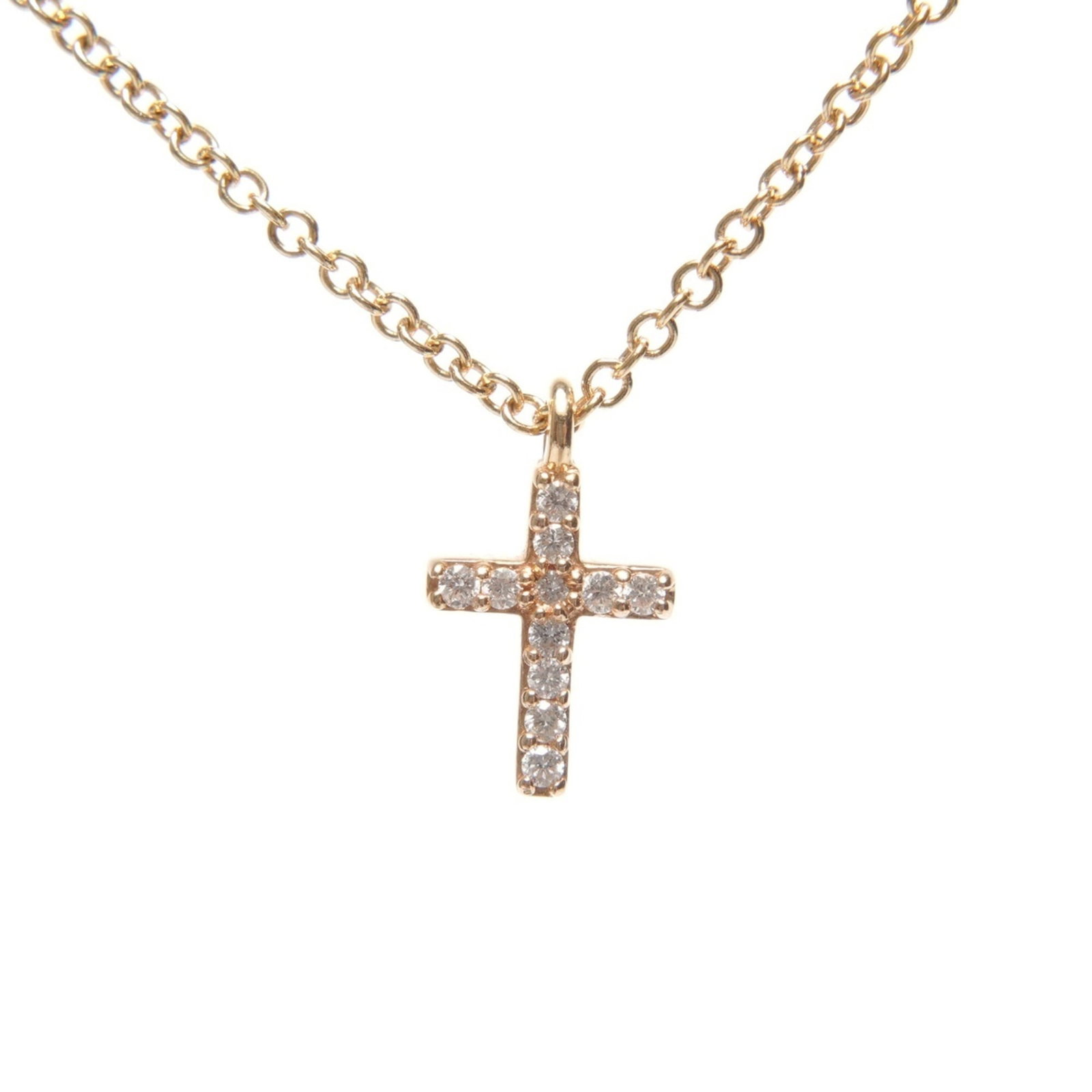 Tiffany & Co. 18k Gold Metro Cross Mini Diamond Necklace WS25673: Tiffany & Co. 18k Gold Metro Cross Mini Diamond Necklace WS25673 A stunning miniature version of the iconic Metro Cross necklace, this 18k gold piece boasts a delicate 9mm x 6mm diamond pendant suspen