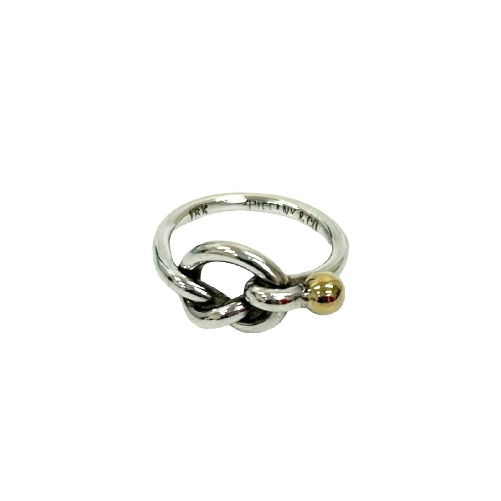 Yellow Gold (18K) - Tiffany Band Ring Silver 925: Yellow Gold (18K) - Tiffany Band Ring Silver 925 A stunning women's band ring, crafted from 18K yellow gold and paired with a silver 925 base, adds a touch of elegance to any outfit. With its classic