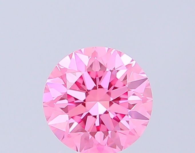 IGI Round 0.5ct Fancy Vivid Pink VVS2 Loose Lab Diamond: IGI Round 0.5ct Fancy Vivid Pink VVS2 Loose Lab Diamond Experience the rare beauty of a Fancy Vivid Pink diamond, one of the most coveted colors in the world of gemstones. This exquisite 0.5ct lab-gro