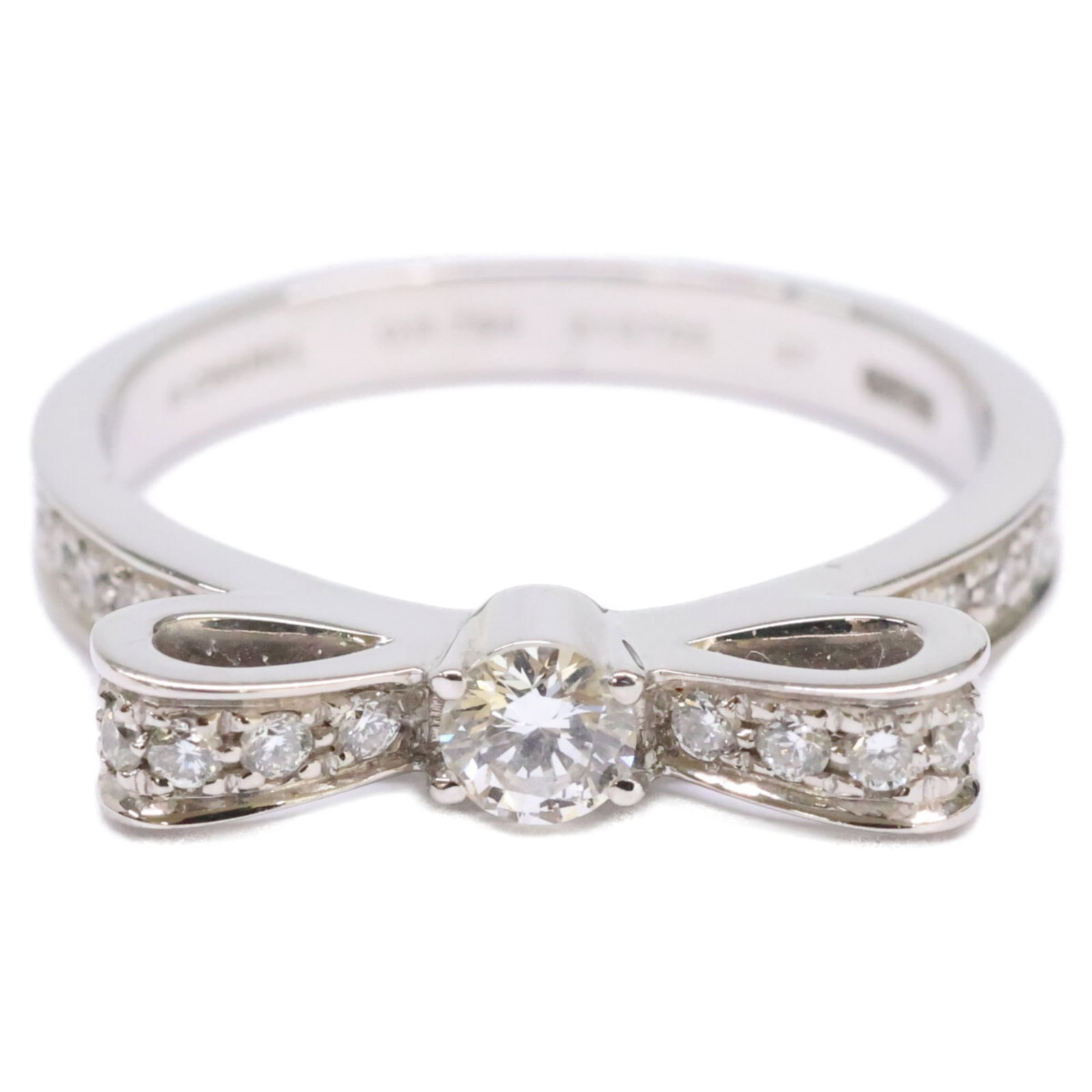 Chanel 18k White Gold Band Ring: Chanel 18k White Gold Band Ring A stunning Chanel band ring in 18k white gold, this timeless piece exudes elegance with its sleek design and premium materials. With a US size 4 fit, it's perfect for a