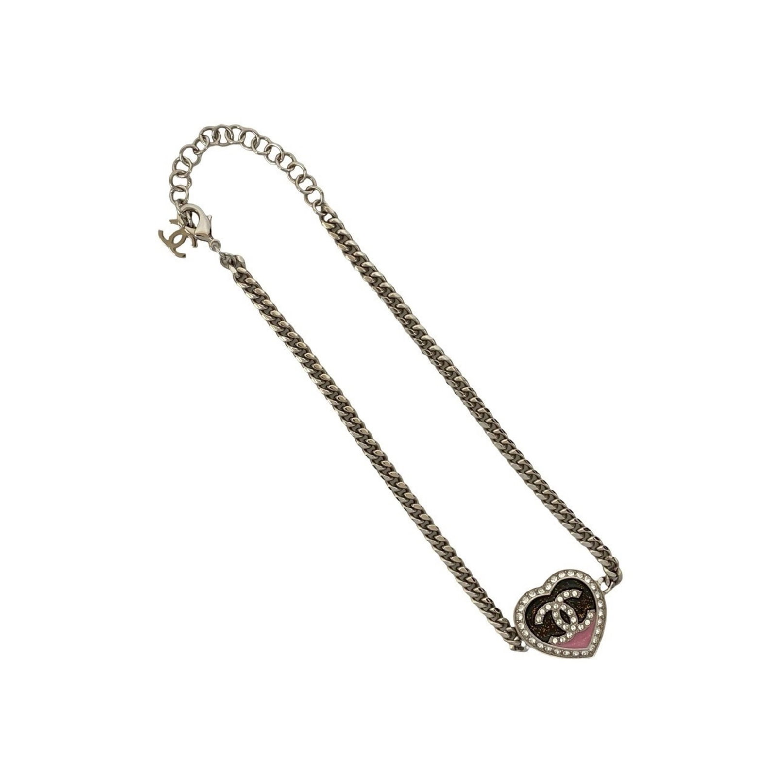 Coco Chanel Heart Motif Plated Rhinestone Silver Necklace Pendant: Coco Chanel Heart Motif Plated Rhinestone Silver Necklace Pendant Elevate your style with the iconic Coco Chanel Heart Motif Plated Rhinestone Silver Necklace Pendant, a timeless piece that exudes ele