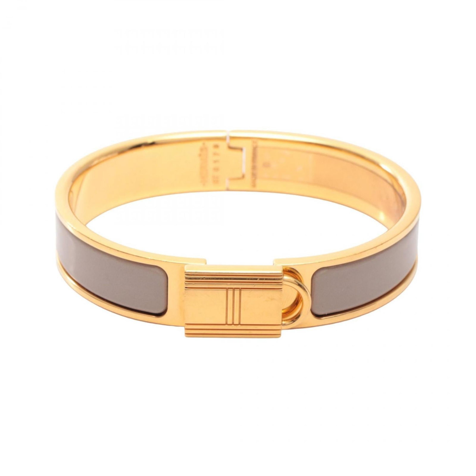 Plating Hermes Bangle Gold: Plating Hermes Bangle Gold A pre-owned Hermes bangle in gold plating, boasting the iconic brand's signature elegance and sophistication. With its classic beige hue and subtle gold accents, this timele