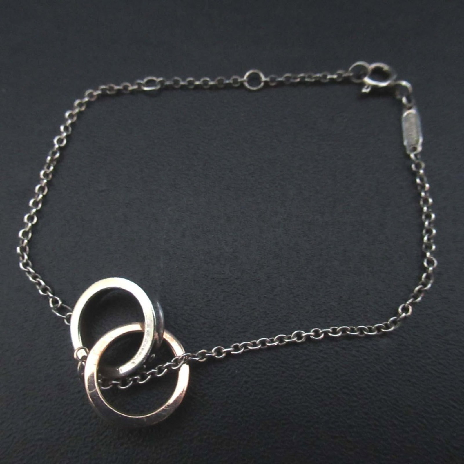 Silver 925 - Tiffany Charm Bracelet Metal: Silver 925 - Tiffany Charm Bracelet Metal A beautiful Tiffany charm bracelet, crafted from sterling silver 925 and adorned with pink gold accents, makes for a timeless and elegant accessory. With its