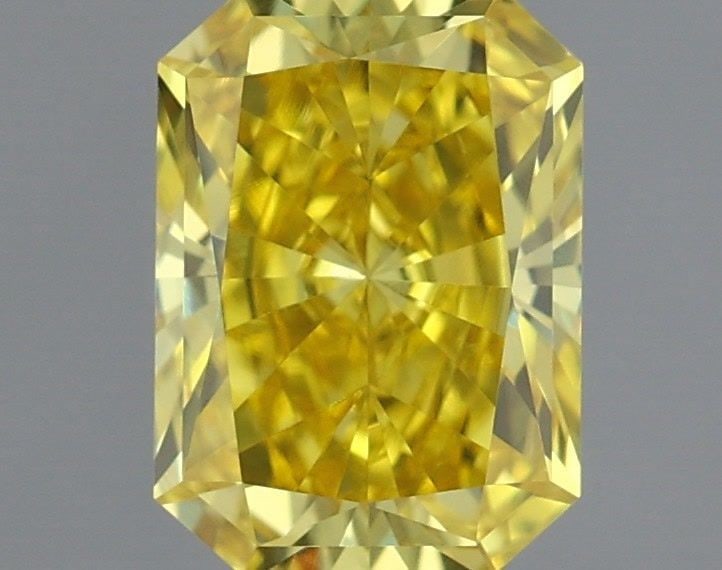 IGI Radiant 0.53ct Fancy Vivid Yellow VVS2 Loose Lab Diamond: IGI Radiant 0.53ct Fancy Vivid Yellow VVS2 Loose Lab Diamond Experience the unparalleled brilliance of a lab-grown diamond, boasting a vibrant Fancy Vivid Yellow hue and exceptional clarity (VVS2) tha