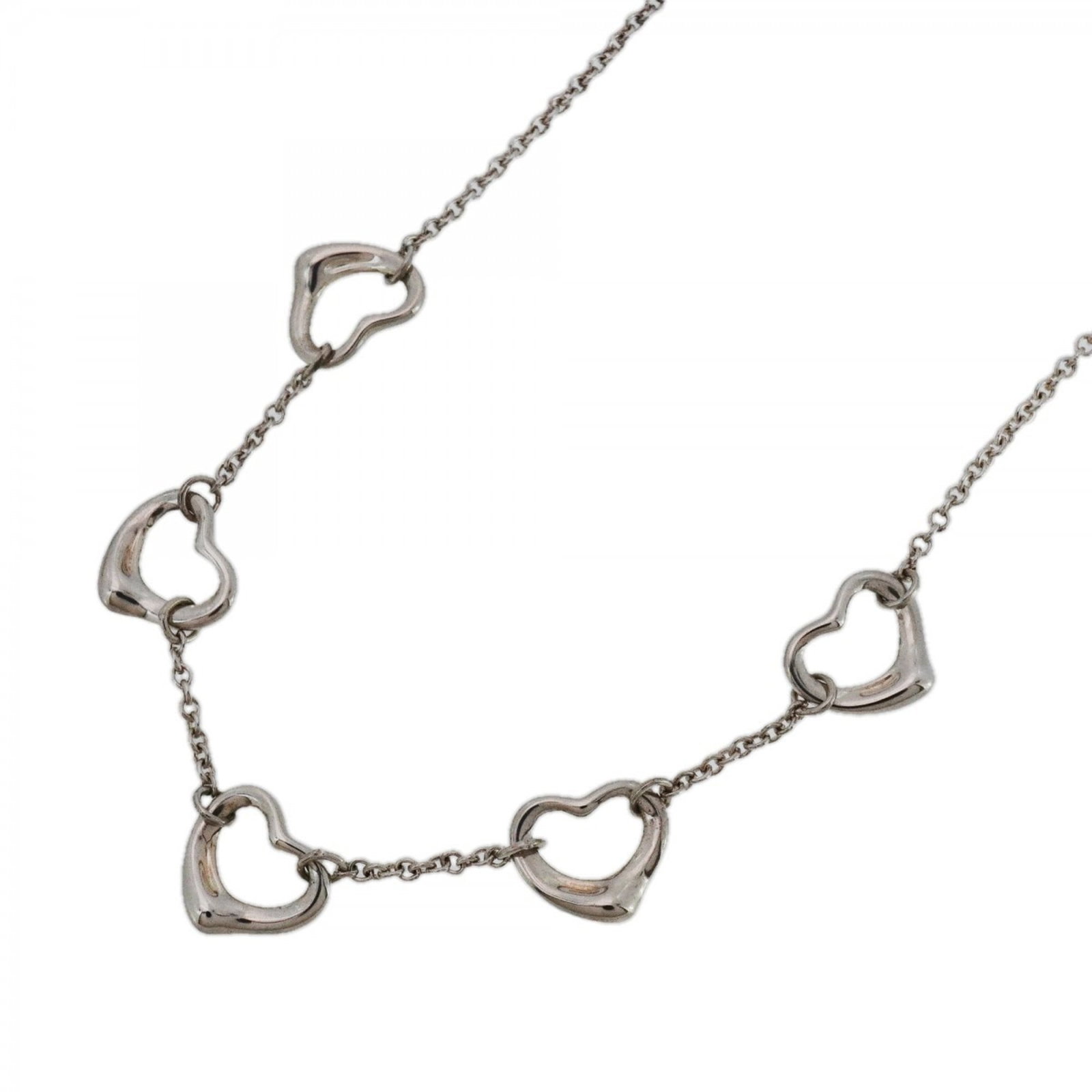 Women's - Tiffany 5-Row Heart Necklace - Silver 925: Women's - Tiffany 5-Row Heart Necklace - Silver 925 Elevate your style with the timeless charm of Tiffany & Co.'s iconic 5-row heart necklace, crafted from sterling silver 925. This exquisite piece bo