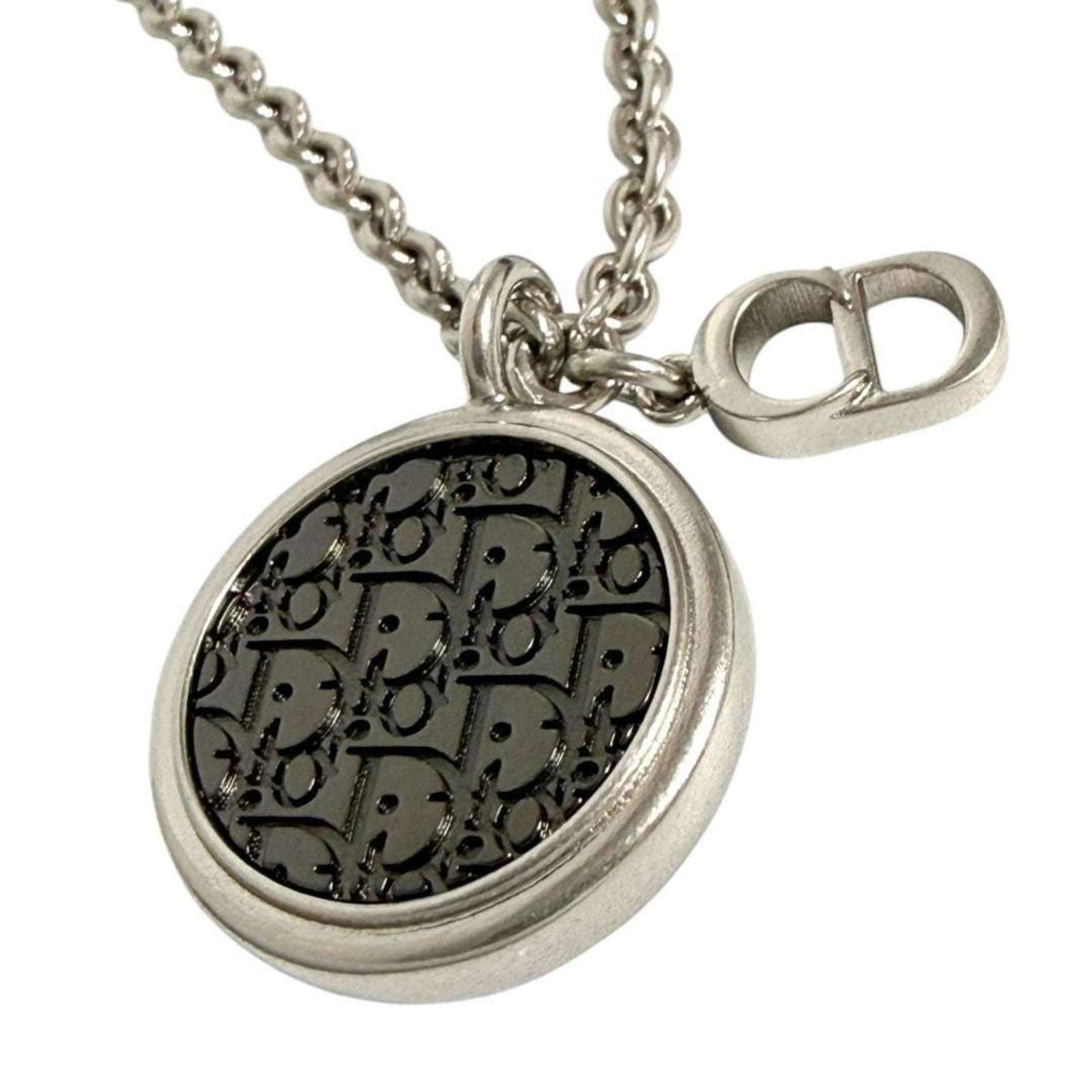 Christian Dior Men's Oblique Circle Pendant Necklace in Silver & Black: Christian Dior Men's Oblique Circle Pendant Necklace in Silver & Black Elevate your style with the iconic Christian Dior Men's Oblique Circle Pendant Necklace, expertly crafted in sleek silver and bol