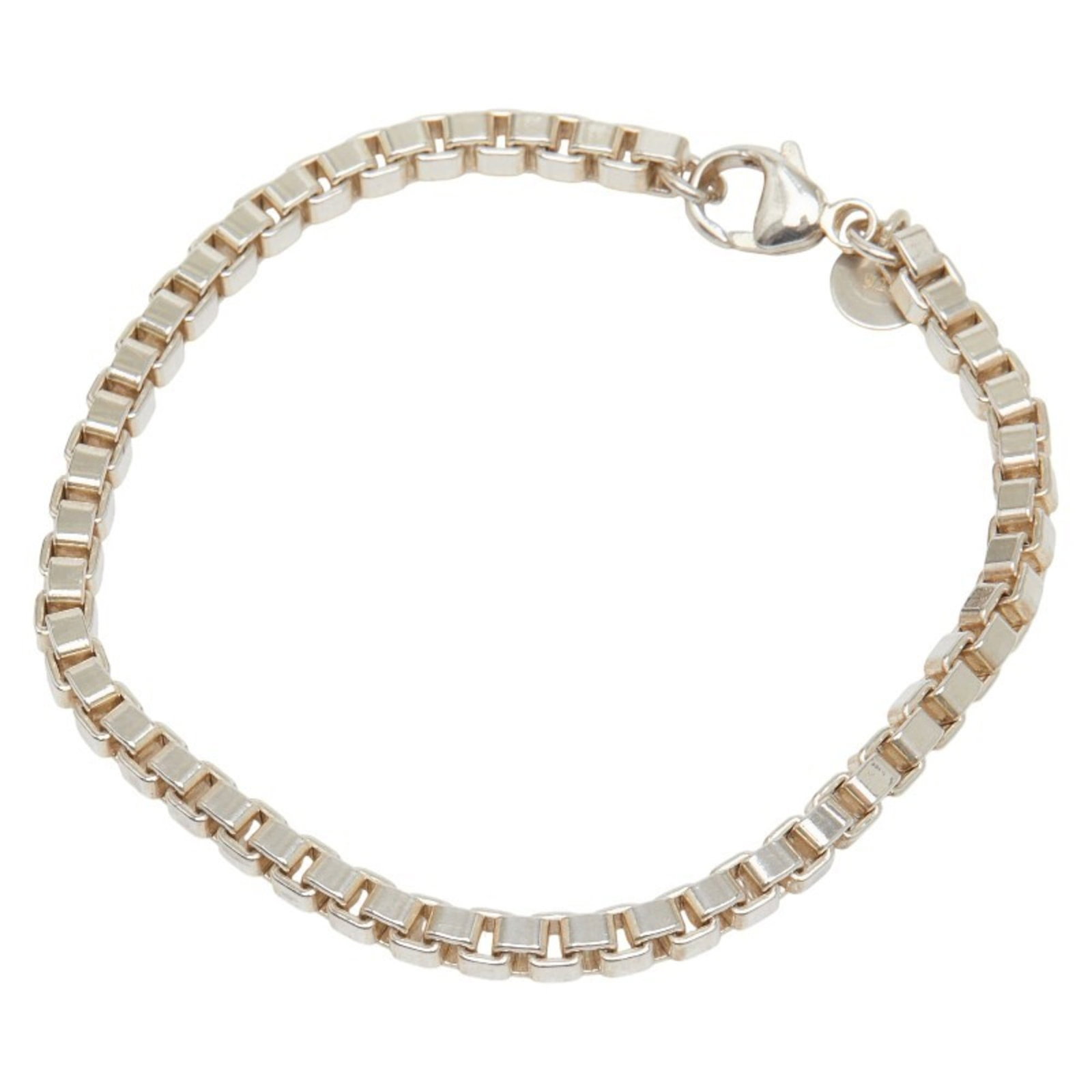 Silver 925 - Tiffany Charm Bracelet Silver: Silver 925 - Tiffany Charm Bracelet Silver A beautiful, pre-owned Tiffany 925 silver charm bracelet in excellent condition, with subtle signs of wear that only add to its timeless charm. The sterling