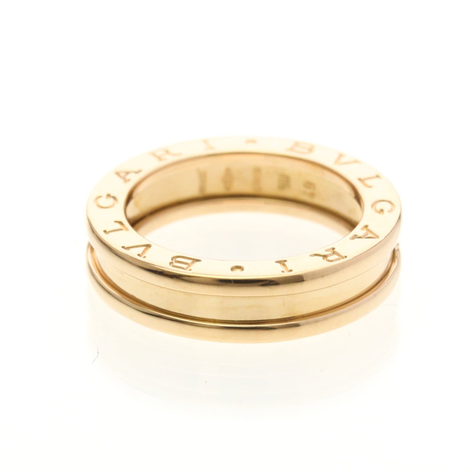 Pink Gold 18k Bvlgari Band Ring: Pink Gold 18k Bvlgari Band Ring Elevate your style with the iconic Bvlgari pink gold band ring, crafted from 18k metal for a luxurious touch. This fashion-forward piece boasts a sleek design and slend