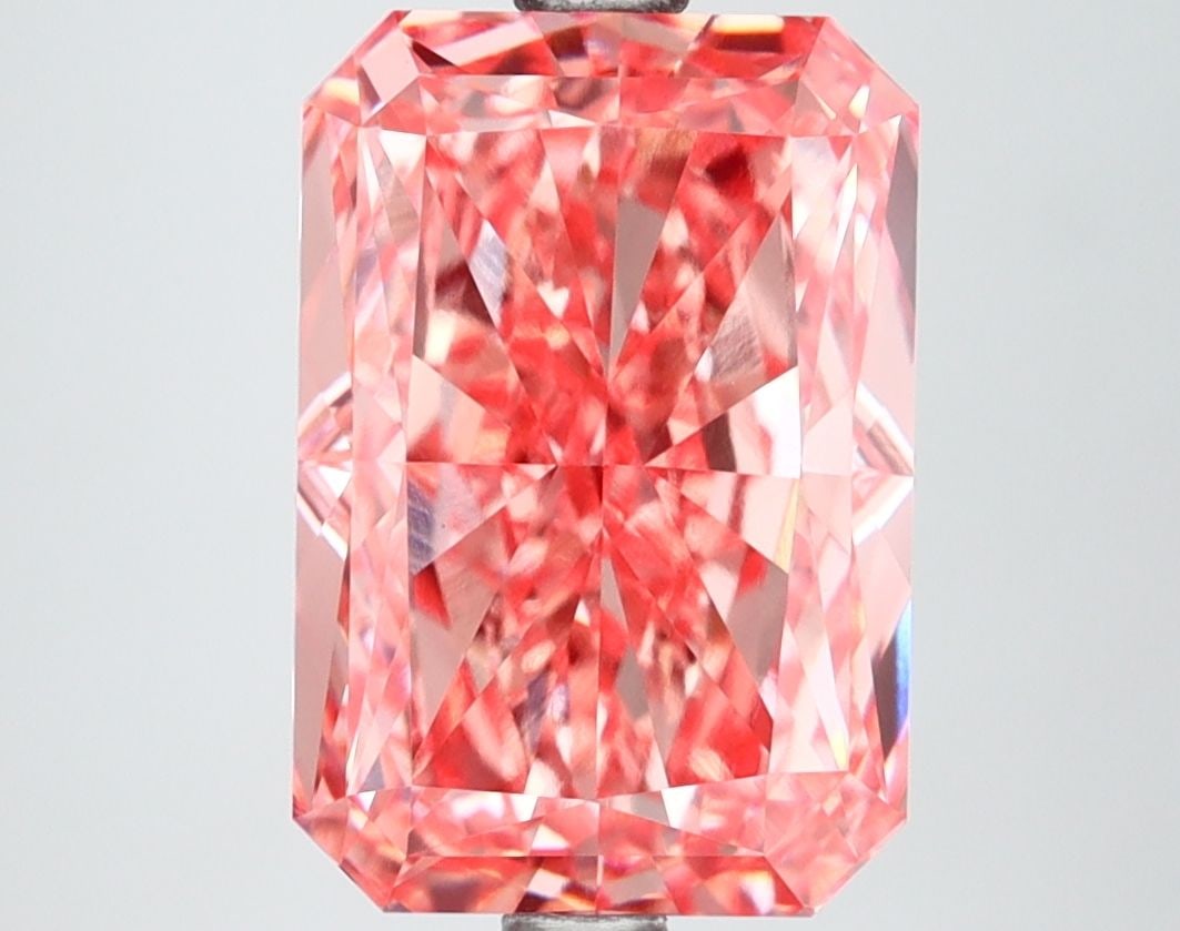 IGI Radiant 4.25ct Fancy Vivid Pink VVS2 Loose Lab Diamond: IGI Radiant 4.25ct Fancy Vivid Pink VVS2 Loose Lab Diamond Experience the breathtaking beauty of a lab-grown diamond, certified by IGI as Fancy Vivid Pink with exceptional clarity and polish. This