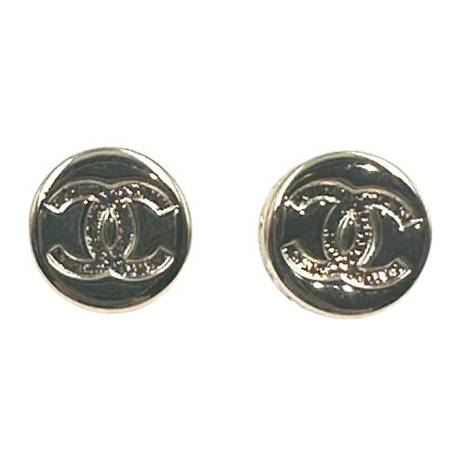 Chanel stud earrings in metal: Chanel stud earrings in metal Elevate your everyday style with these stunning Chanel stud earrings in champagne gold metal, expertly crafted to add a touch of luxury to any outfit. With their sleek de