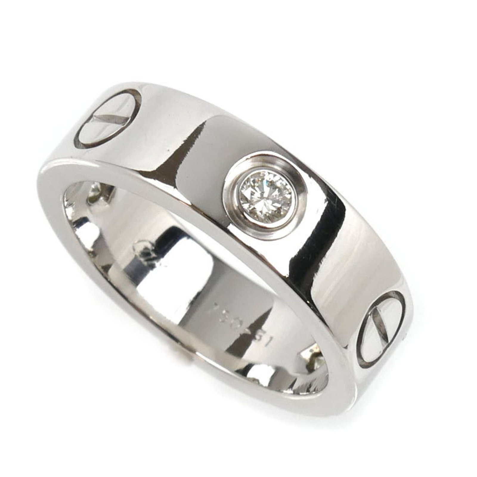 Cartier 18k White Gold Band Ring: Cartier 18k White Gold Band Ring A stunning Cartier band ring in 18k white gold, adorned with a diamond stone, adds a touch of timeless elegance to any outfit. This pre-owned beauty boasts excellent c