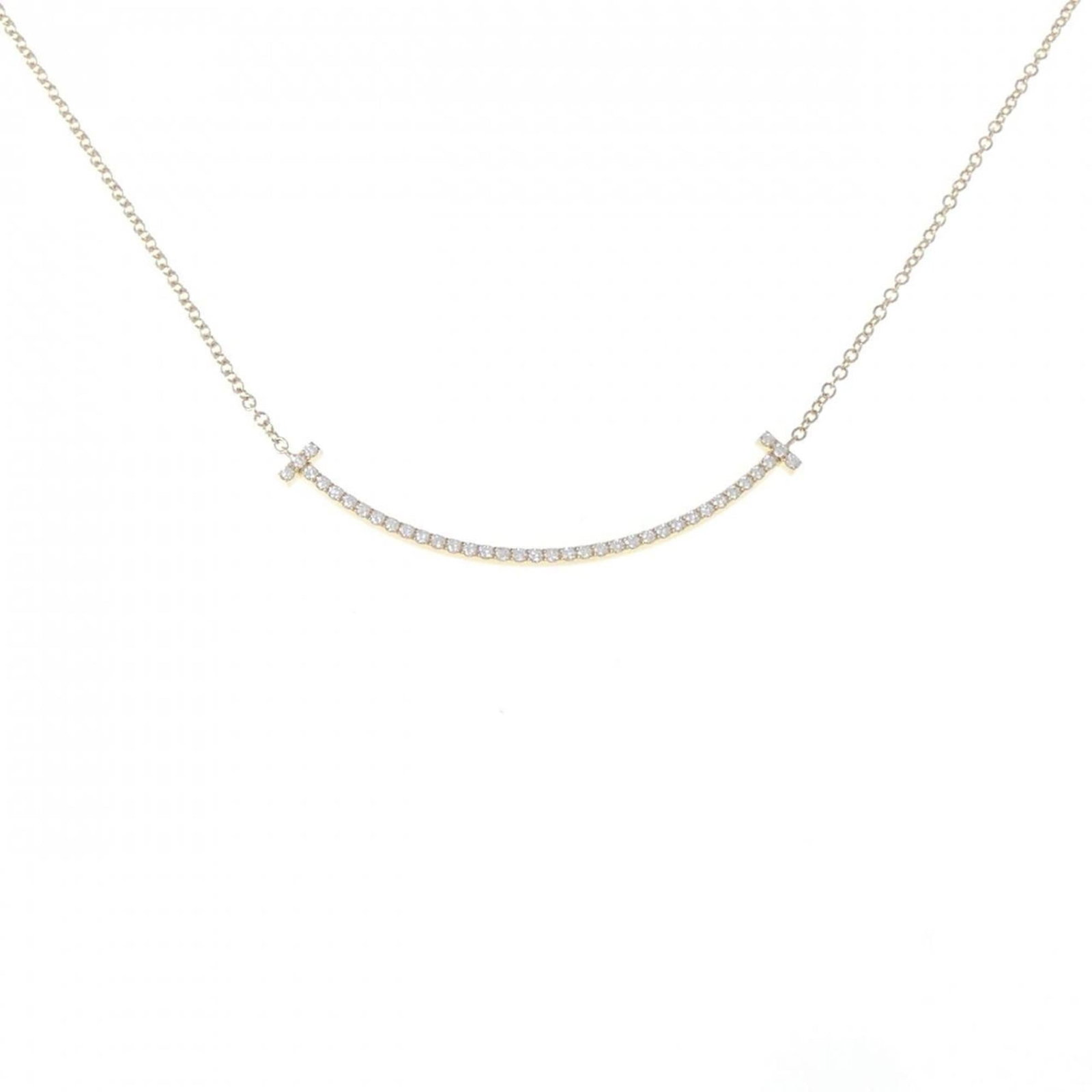 Necklace Tiffany T Smile Small: Necklace Tiffany T Smile Small Elevate your style with the iconic Tiffany & Co. necklace, boasting a stunning 3.5mm diamond pendant suspended from a delicate yellow gold chain. The sleek design and ti