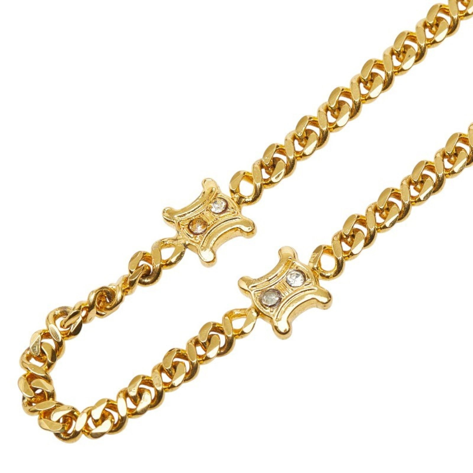 Celine Triomphe Chain Necklace in Gold Plated with Rhinestones for Women: Celine Triomphe Chain Necklace in Gold Plated with Rhinestones for Women Elevate your everyday style with the Celine Triomphe Chain Necklace, boasting a stunning gold plated finish and intricate rhine