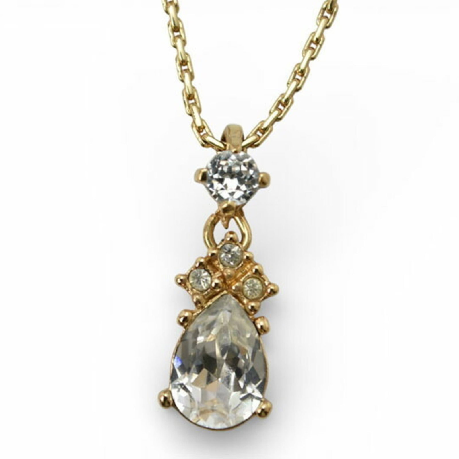 Christian Dior Teardrop Rhinestone Necklace in Gold: Christian Dior Teardrop Rhinestone Necklace in Gold Elevate your elegance with the iconic Christian Dior Teardrop Rhinestone Necklace in 24k gold, boasting a stunning rhinestone pendant that adds a to