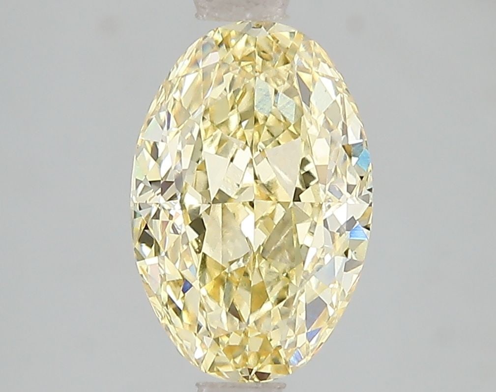 IGI Oval 2.59ct Fancy Intense Yellow VVS2 Loose Lab Diamond: IGI Oval 2.59ct Fancy Intense Yellow VVS2 Loose Lab Diamond Experience the vibrant beauty of nature in this stunning 2.59ct Fancy Intense Yellow VVS2 lab-grown diamond, certified by IGI and boasting e