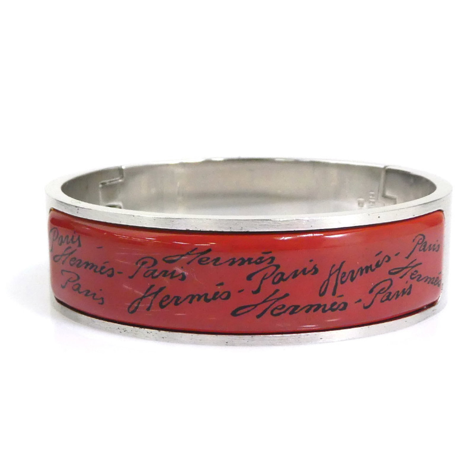 Hermes Bangle with Enamel and Metal: Hermes Bangle with Enamel and Metal A sleek and sophisticated Herm?s bangle, crafted from high-quality metal and adorned with vibrant enamel details in black, red, and brown hues, adds a touch of luxu