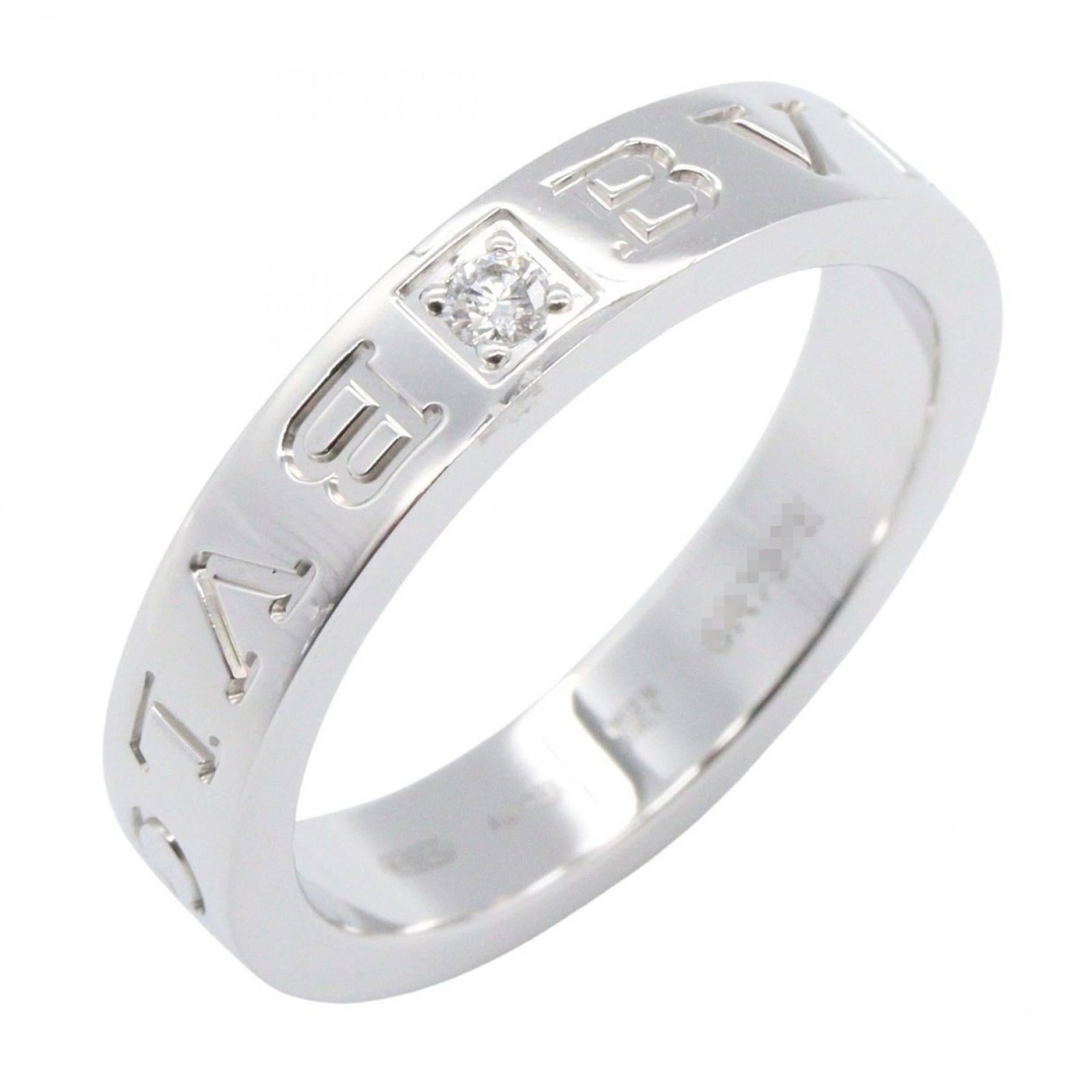 Bvlgari White Gold 18k Band Ring: Bvlgari White Gold 18k Band Ring Elevate your style with the Bvlgari White Gold 18k Band Ring, a timeless piece adorned with a clear diamond and crafted from high-quality white gold. Its classic desig