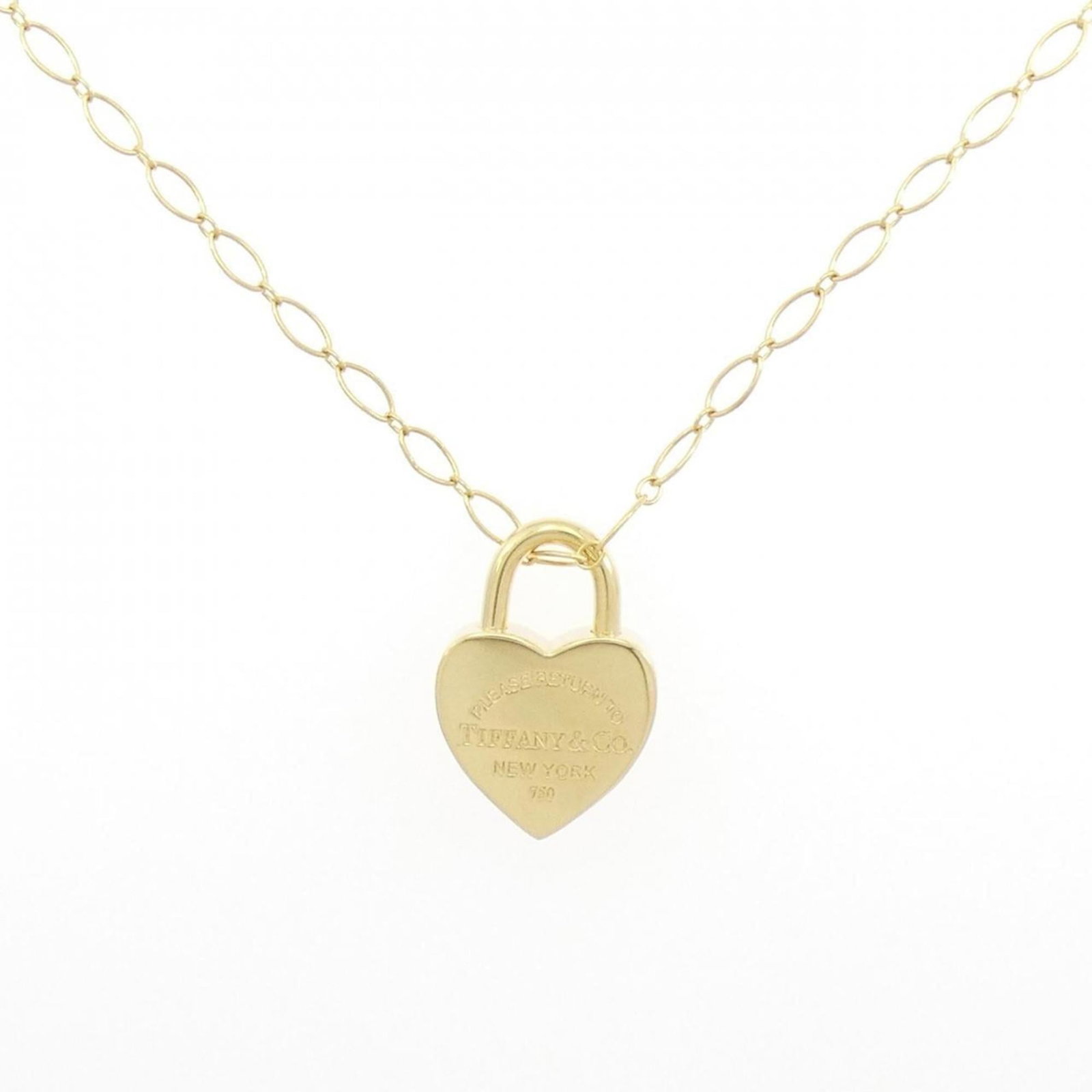 Return to Tiffany Heart Lock Necklace: Return to Tiffany Heart Lock Necklace A timeless piece of elegance, the Return to Tiffany Heart Lock Necklace is a classic symbol of love and sophistication. Crafted from 14k yellow gold, this delicat