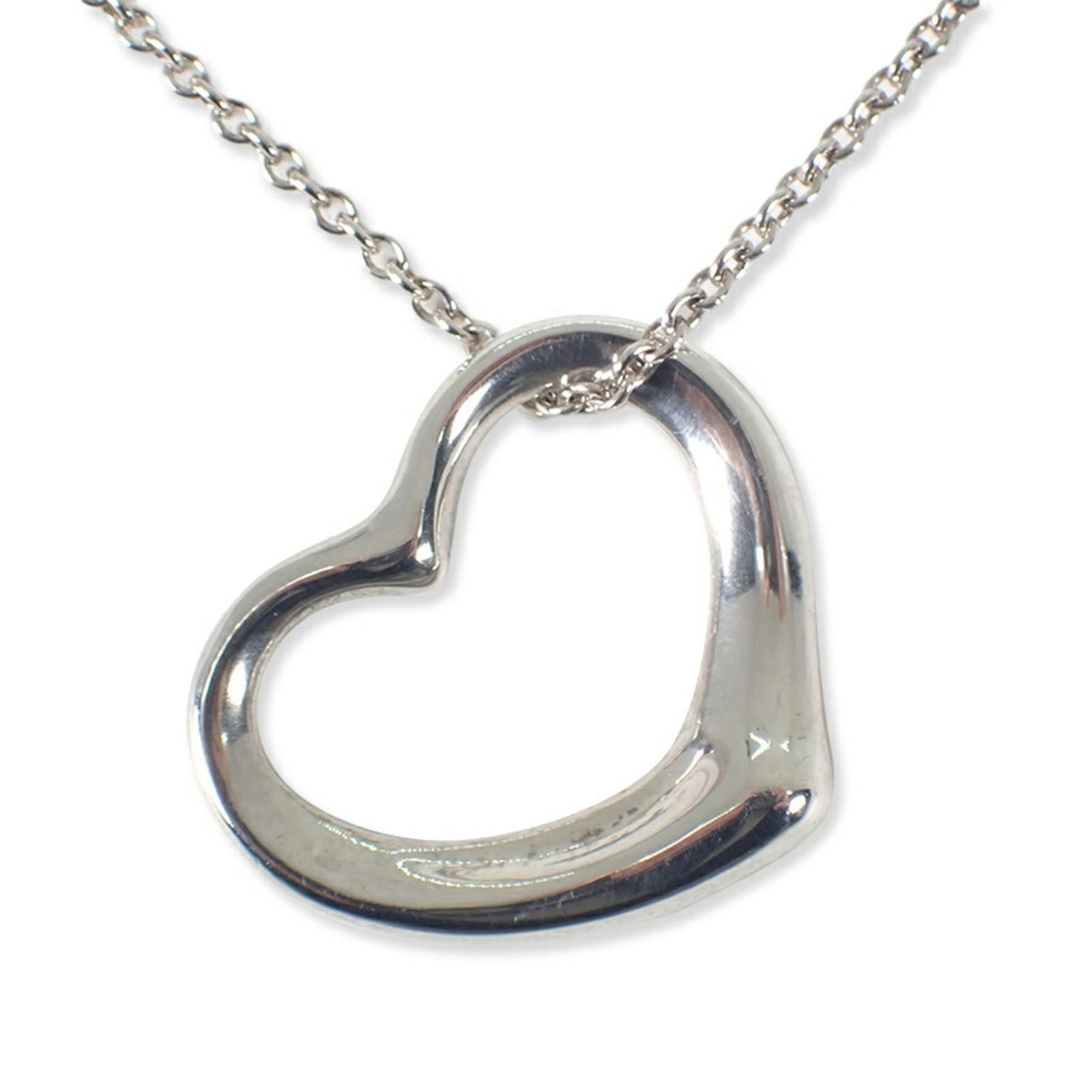 necklace TIFFANY 925 heart pendant: necklace TIFFANY 925 heart pendant A stunning sterling silver Tiffany necklace, adorned with a beautiful 925 heart pendant, adds a touch of elegance to any outfit. Its classic design and high-quality