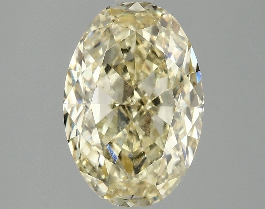 IGI Oval 3.06ct Fancy Vivid Yellow VVS2 Loose Lab Diamond: IGI Oval 3.06ct Fancy Vivid Yellow VVS2 Loose Lab Diamond Experience the exceptional brilliance of a lab-grown Fancy Vivid Yellow diamond, boasting an impressive 3.06 carats in its oval shape.